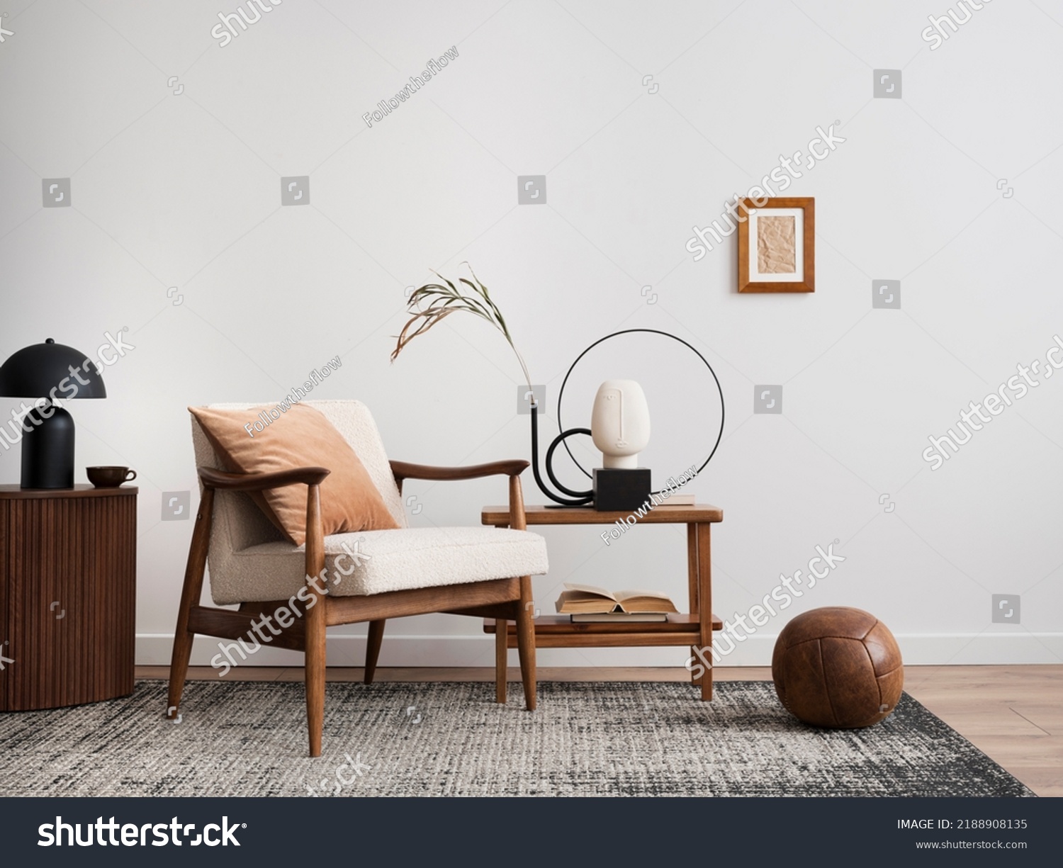 Minimalist composition of elegant living room space with white boucle armchair, photos mock up frames, carpet, coffee table, lamp, decoration and personal accessories. Copy space. Template.  #2188908135