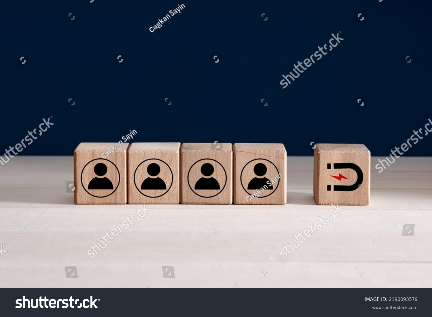 Inbound marketing strategy, customer retention, digital marketing and attracting potential customers in business concept. Wooden cubes with magnet icon attracts the customer icons. #2190093579