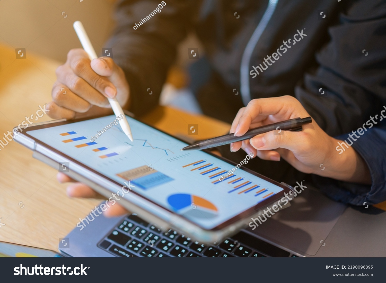 close up ceo businesswoman hand point on dashboard screen tablet device for ask and share idea or consulting with businessman partner for business team and work from home concept #2190096895