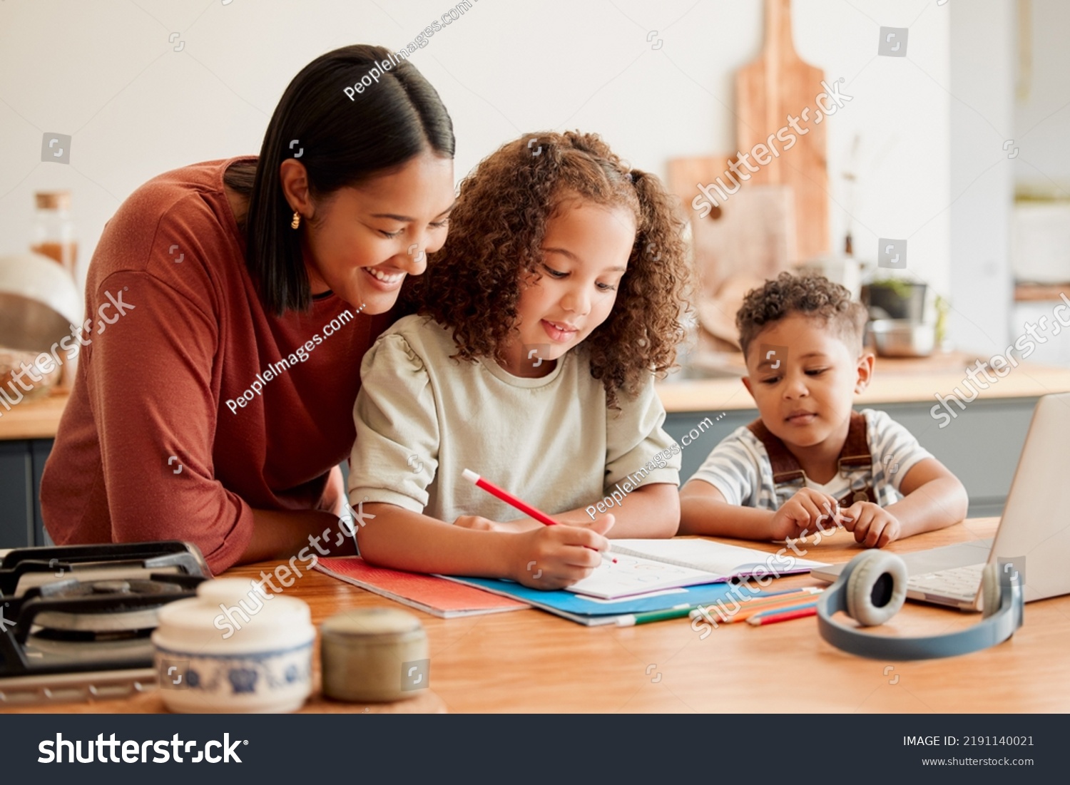 Mother teaching, learning and education with child studying, doing homework or writing in book during an at home lesson or homeschooling. Daughter in early childhood development enjoying fun #2191140021