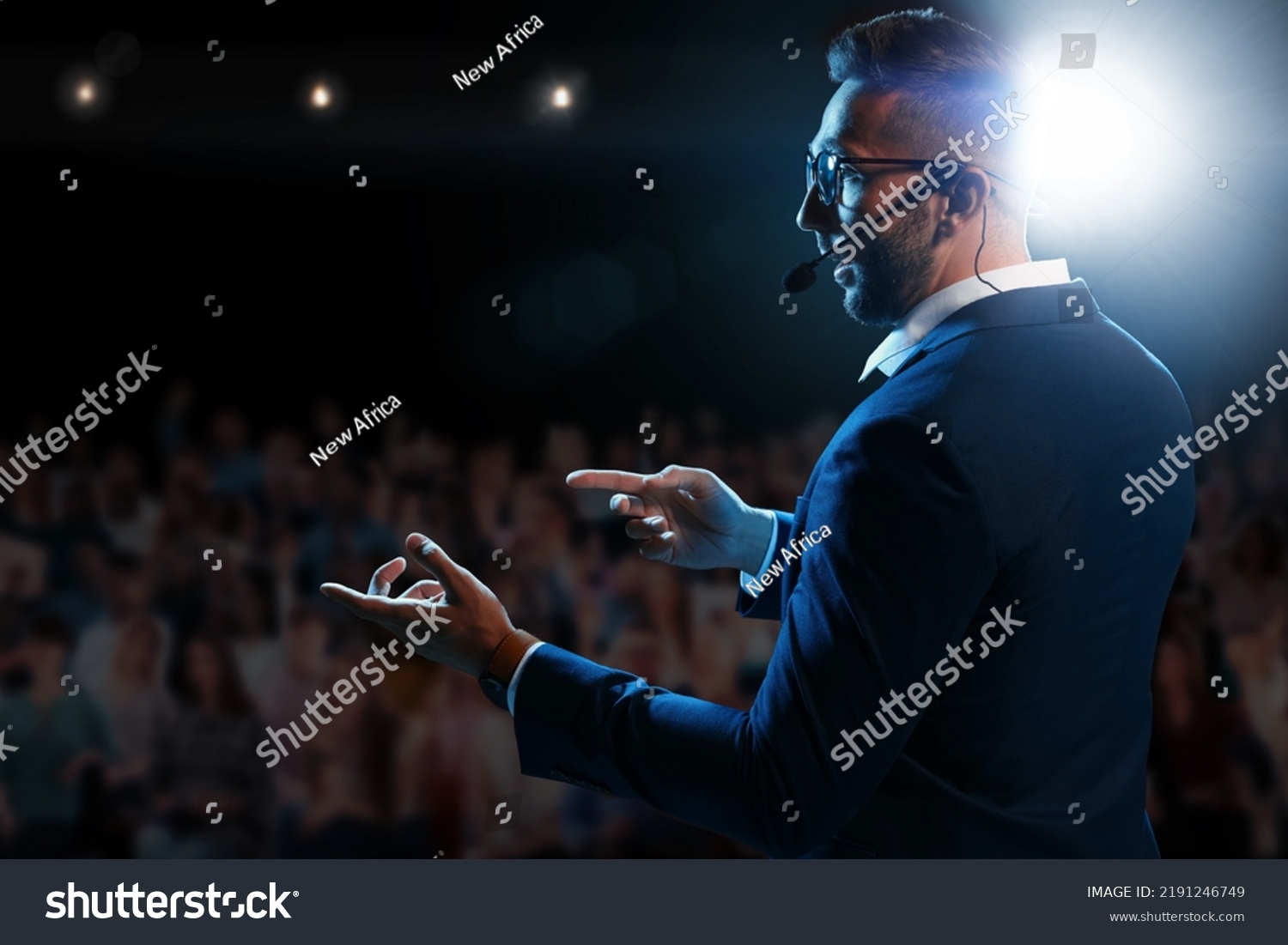 Motivational speaker with headset performing on stage #2191246749