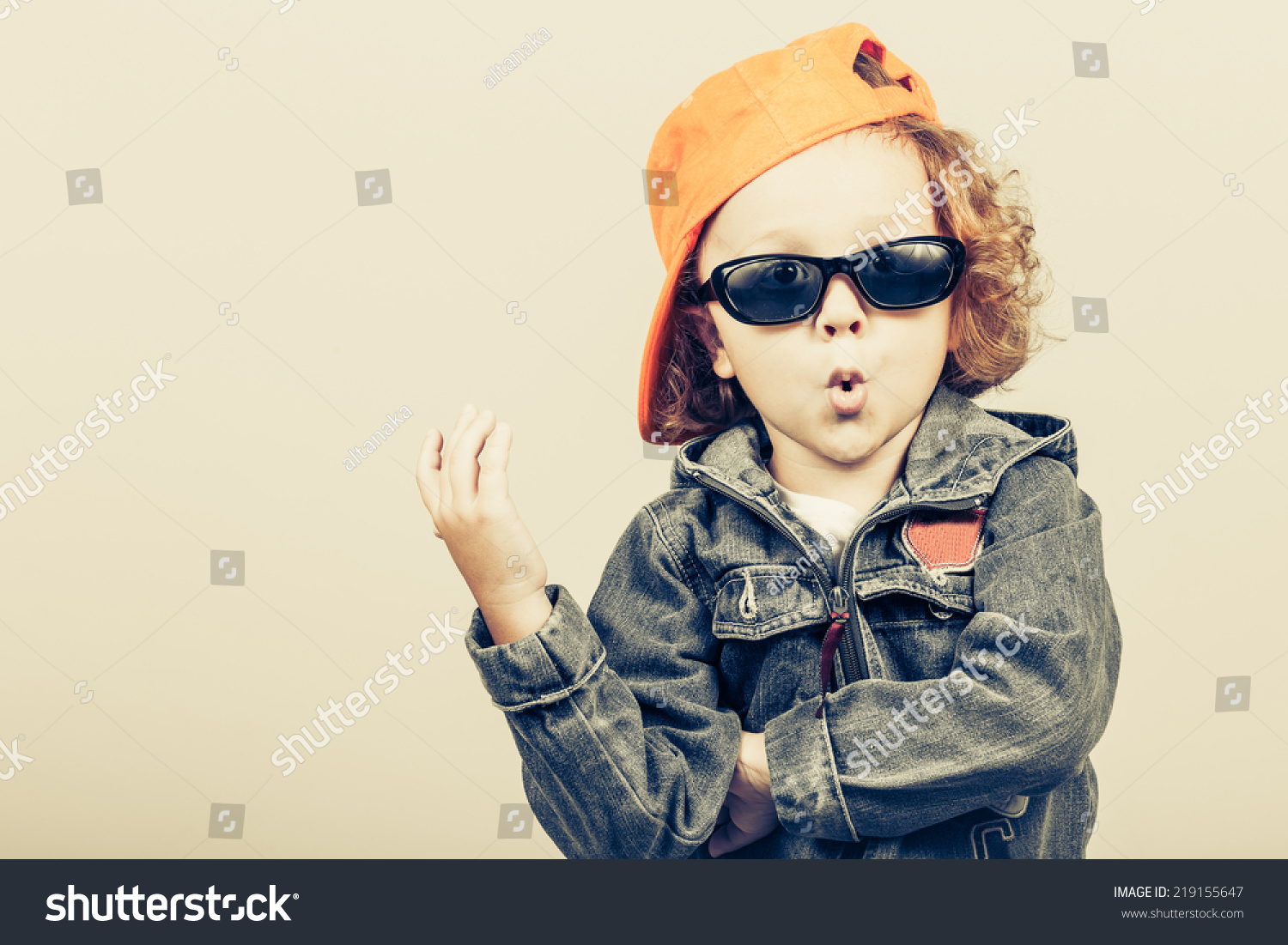 Fashion child. Happy boy model. Stylish little boy in baseball.  Handsome  kid  in the jeans jacket. #219155647