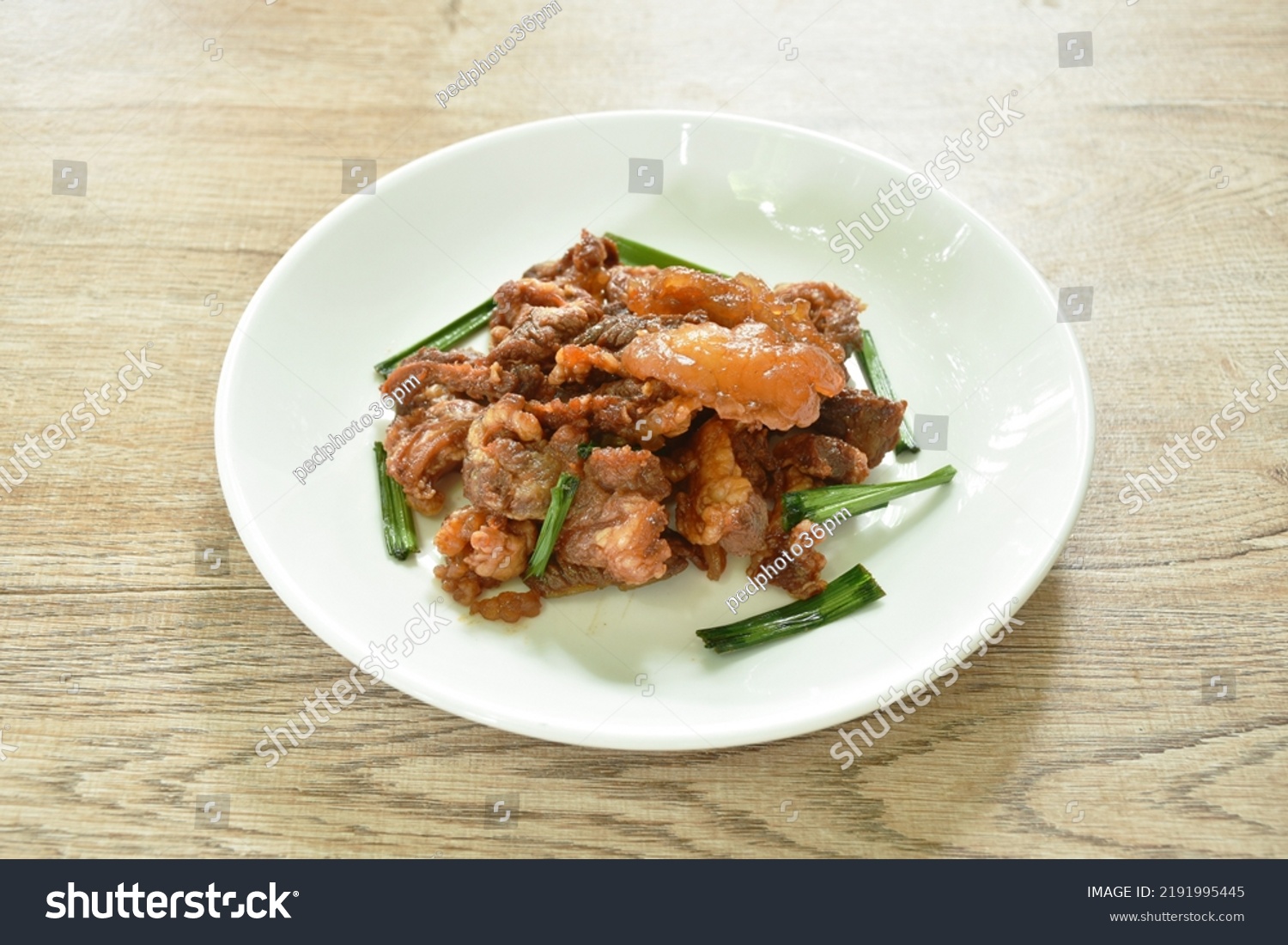 fried fermenting beef meat with pandan leaf on plate #2191995445
