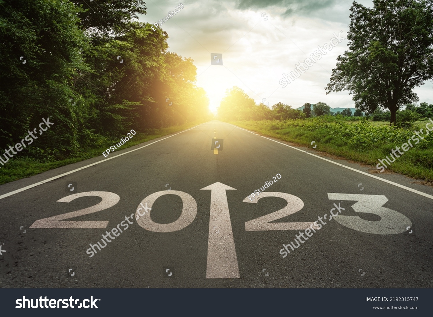New year 2023 or straightforward concept. Text 2023 written on the road in the middle of asphalt road at sunset.Concept of planning and challenge, business strategy, opportunity ,hope, new life change #2192315747