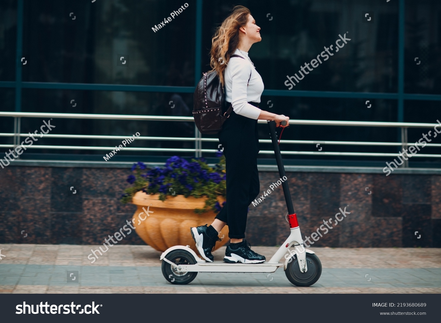 Young woman with electric scooter at the city. #2193680689