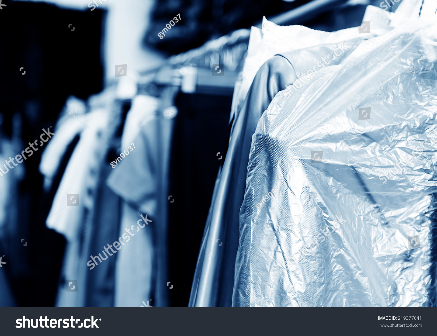 Laundry, hanging on the racks of old clothes. #219377641