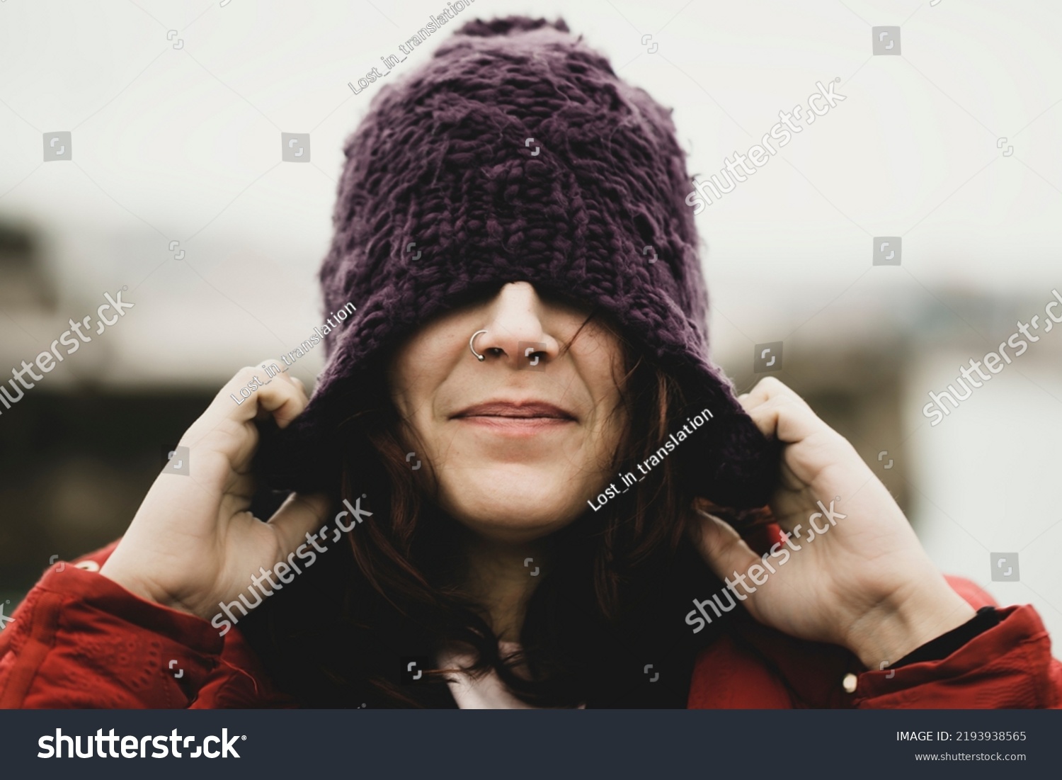 pull head wool cap autumn winter casual woman wearing wool hat outdoors hiding her eyes under fashion knitted cap. Winter wool hat and septum piercing. hat for the cold. Protect hair the cold #2193938565