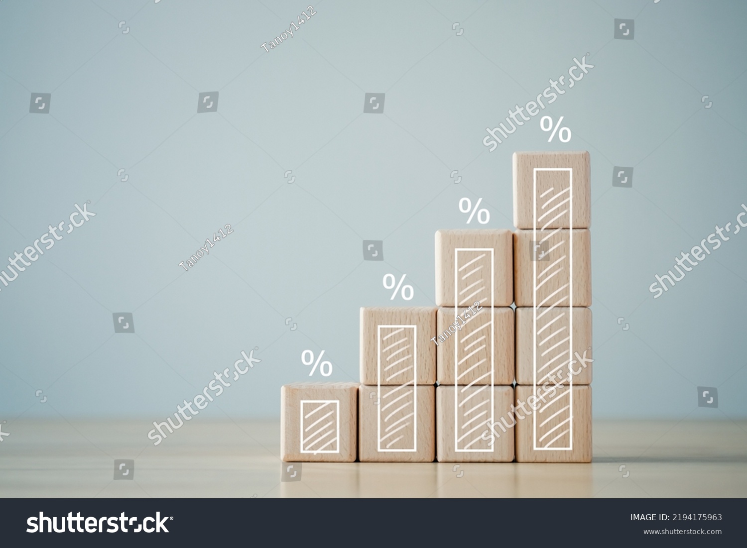 Interest rate finance and mortgage rates concept. Wooden blocks with growth of bar chart percentage sign, financial growth, interest rate increase, inflation, sale price and tax rise concept. #2194175963