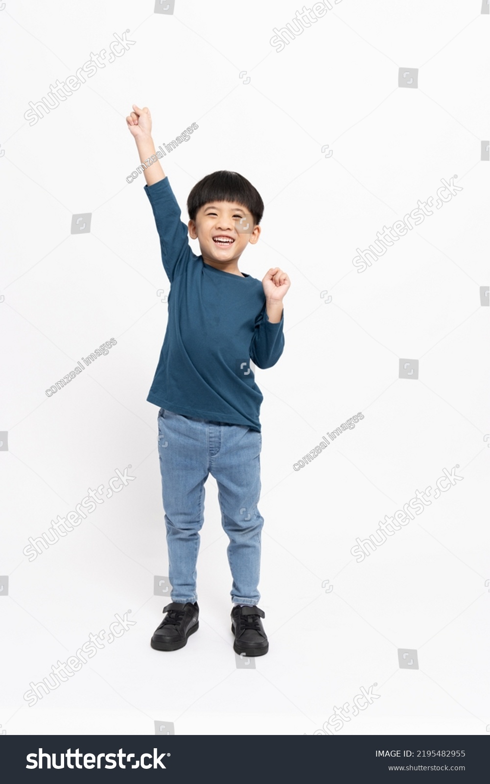 Happy Asian little boy hands up raised arms from happiness isolated on white background, Excited kid winner success concept, Looking at camera and full body composition #2195482955