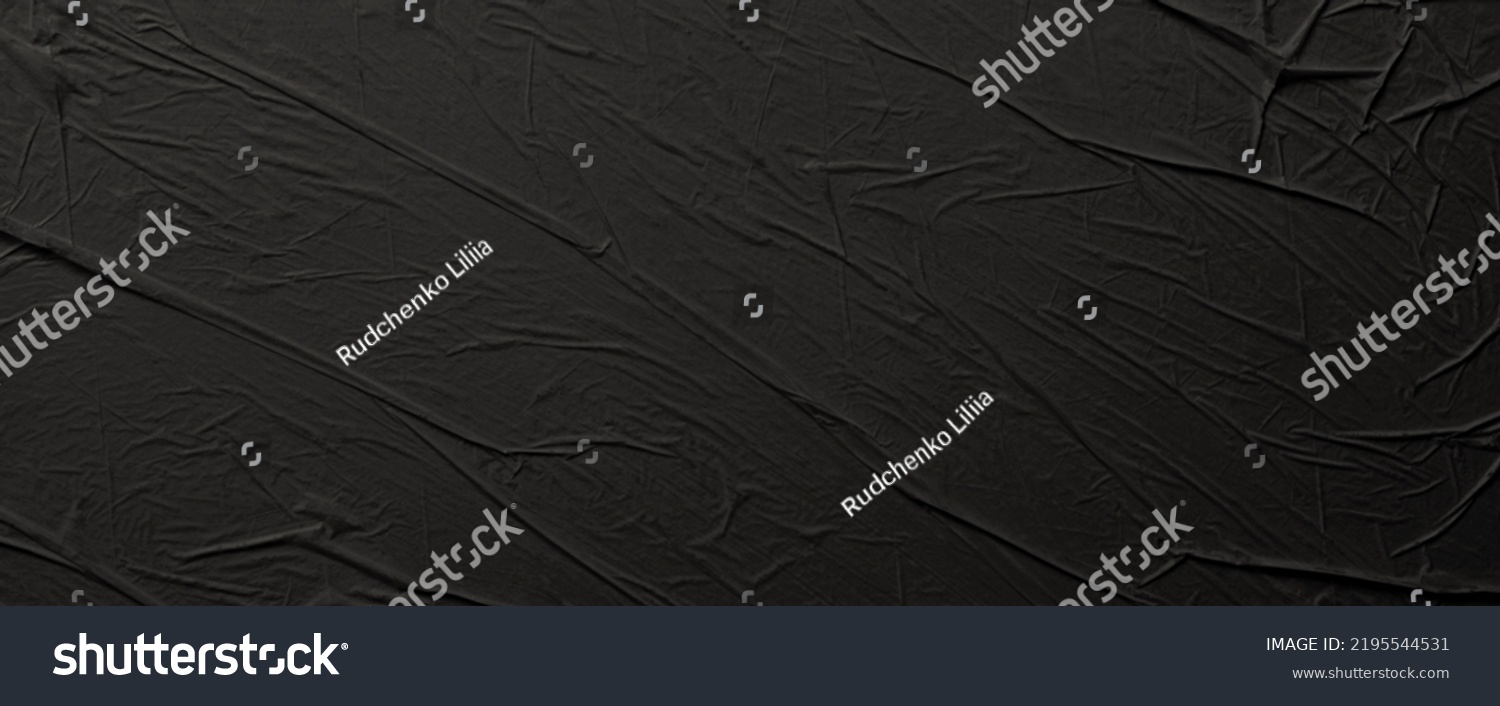 Empty crumpled wet black paper blank texture copy space wall horizontal long background. #2195544531