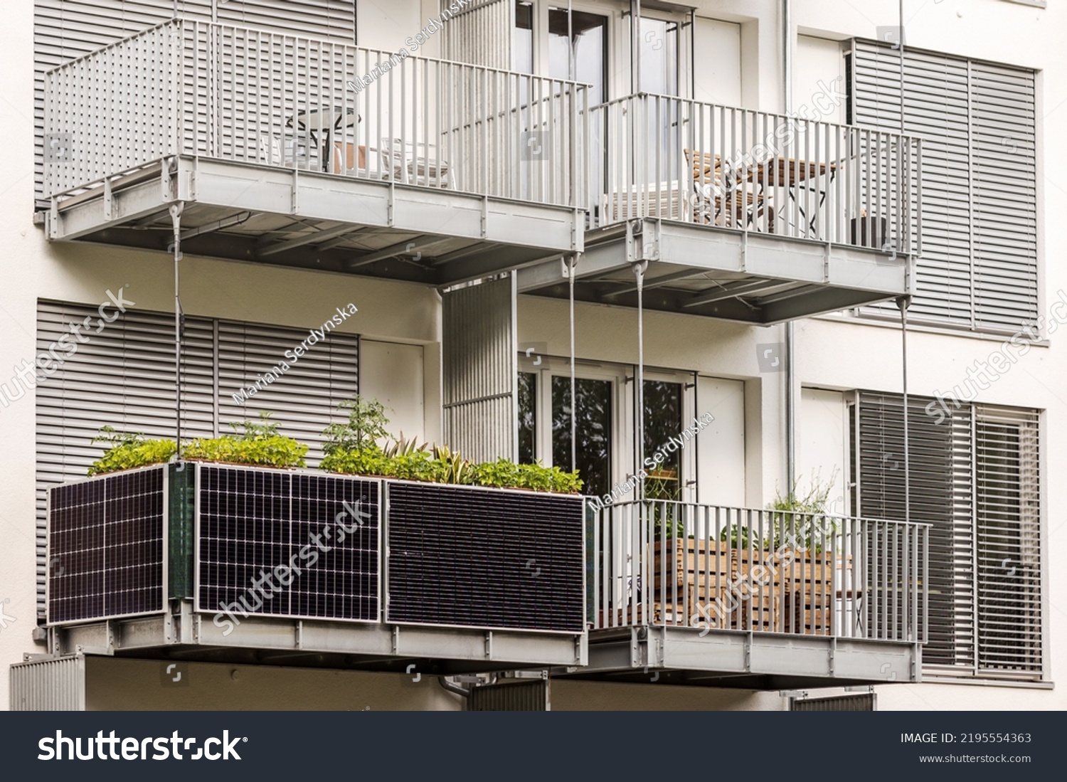 Solar panels on Balcony of  Apartment Building in City. Modern Balcony with Solar Panel. #2195554363