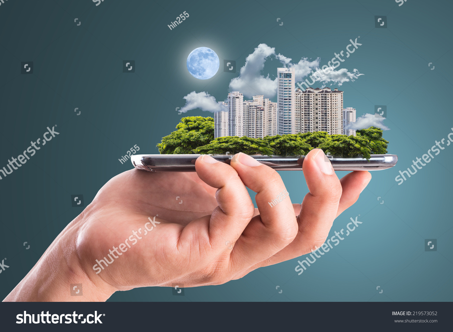 Cityscape intelligent building ,hold smart phone for build and make your green city. #219573052
