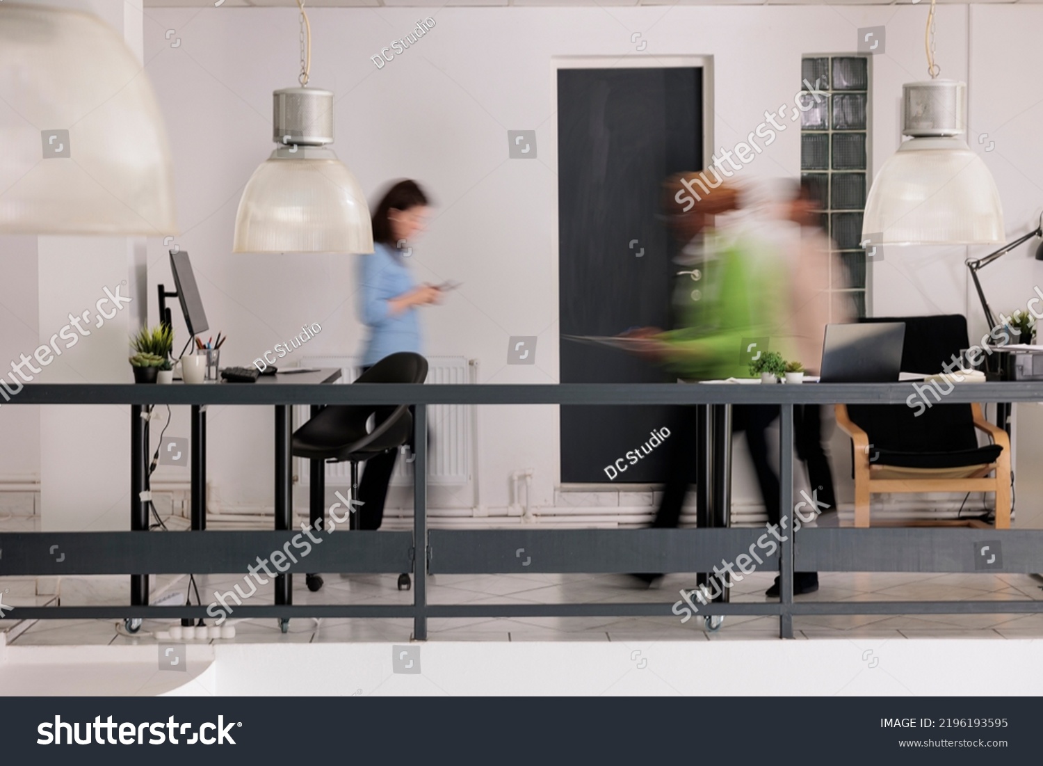 Diverse employees silhouettes walking in business coworking space, long exposure effect. Blurred busy professional workers, start up office staff workday, work rush concept, wide shot #2196193595