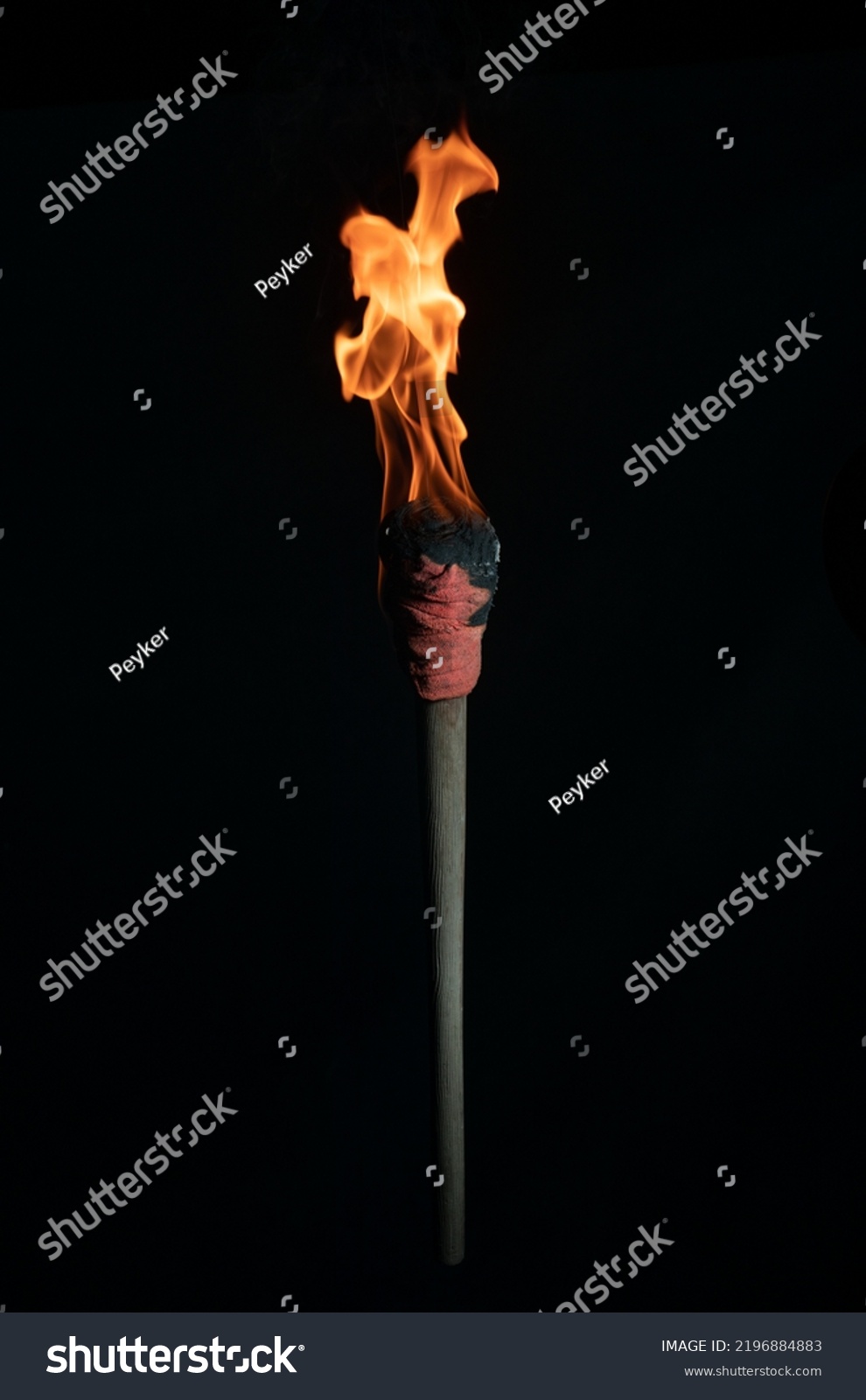 ancient wooden torch isolated on black background #2196884883