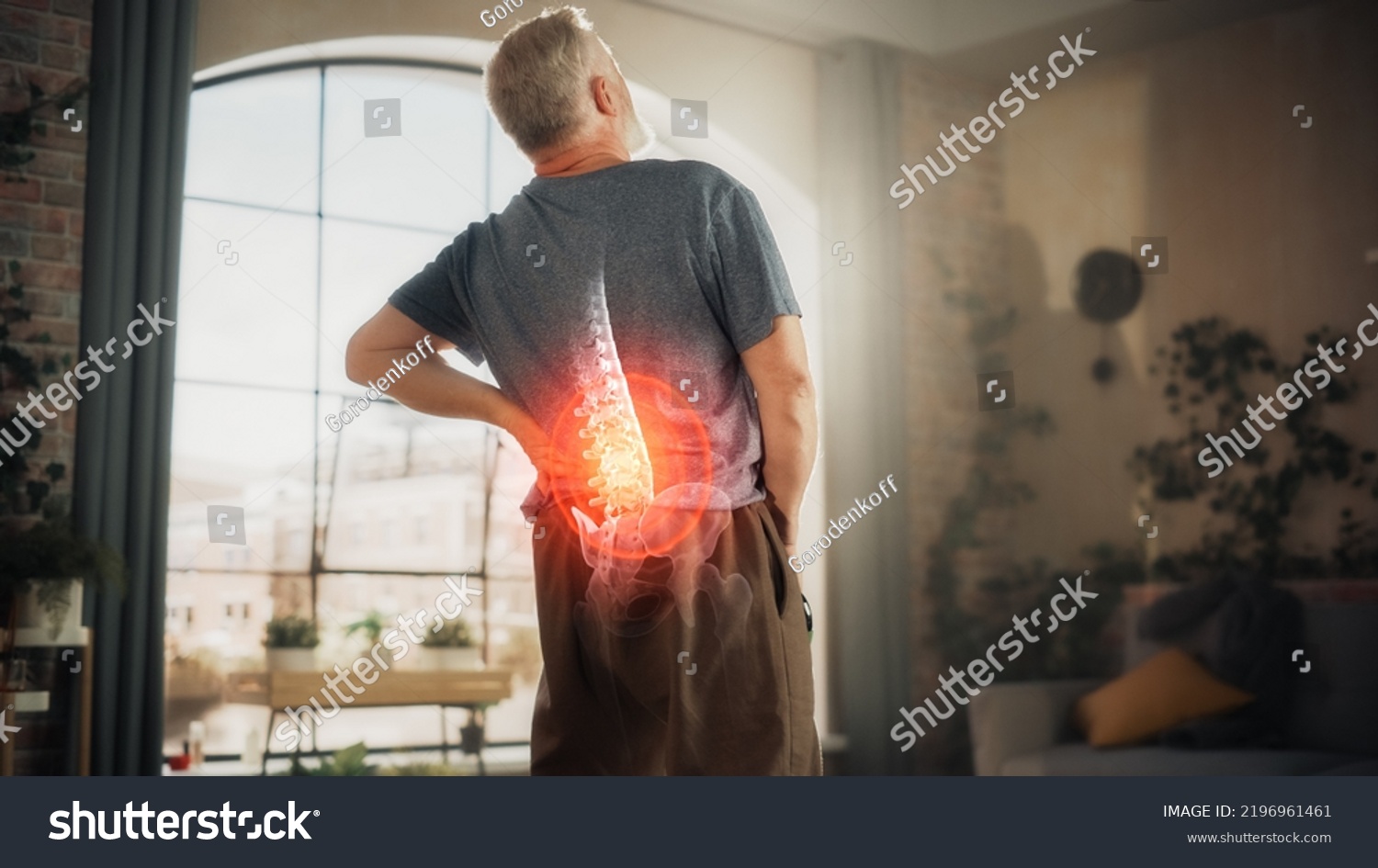 VFX Back Pain Augmented Reality Animation. Close Up of a Senior Male Experiencing Discomfort in a Result of Spine Trauma or Arthritis. Man Massaging and Stretching the Back to Ease the Injury. #2196961461