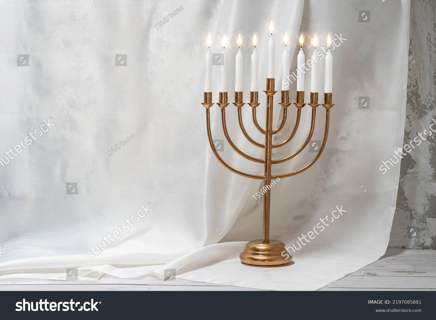 Jewish Hanukkah Menorah 9 Branch Candlestick. Holiday Candle Holder. Nine-arm candlestick. Traditional Hebrew Festival of Lights candelabra. Background for design with copy space. #2197085881