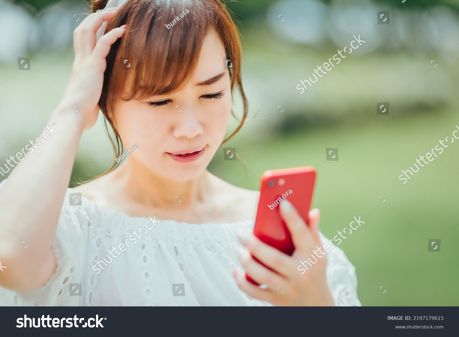 A woman using a smartphone (failure, stress) #2197179615