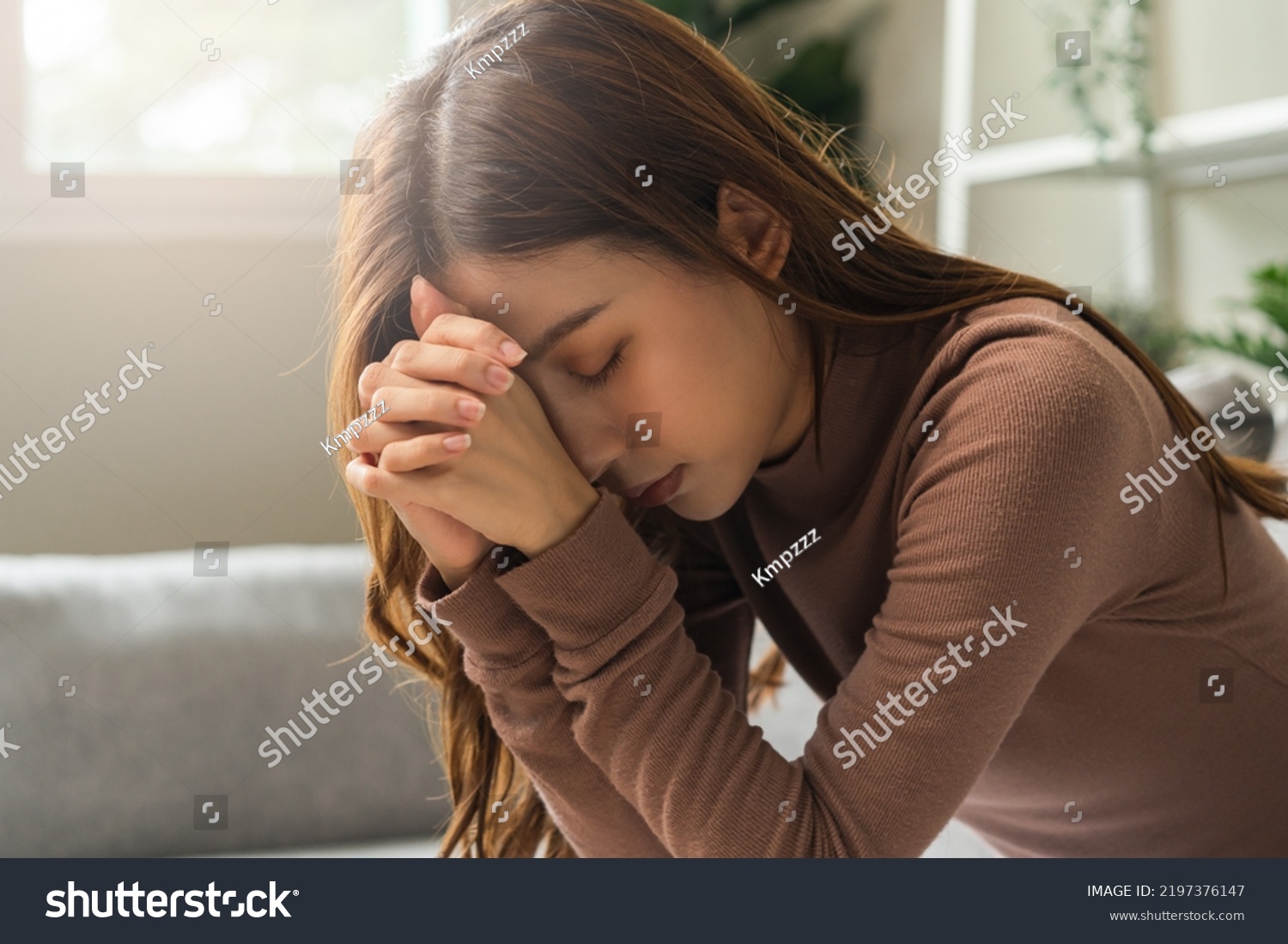 Believe faith charity, calm asian young woman show gratitude, folded hands in prayer feel grateful, meditating with her eyes closed, praying to request God for help. Religious, forgiveness concept. #2197376147