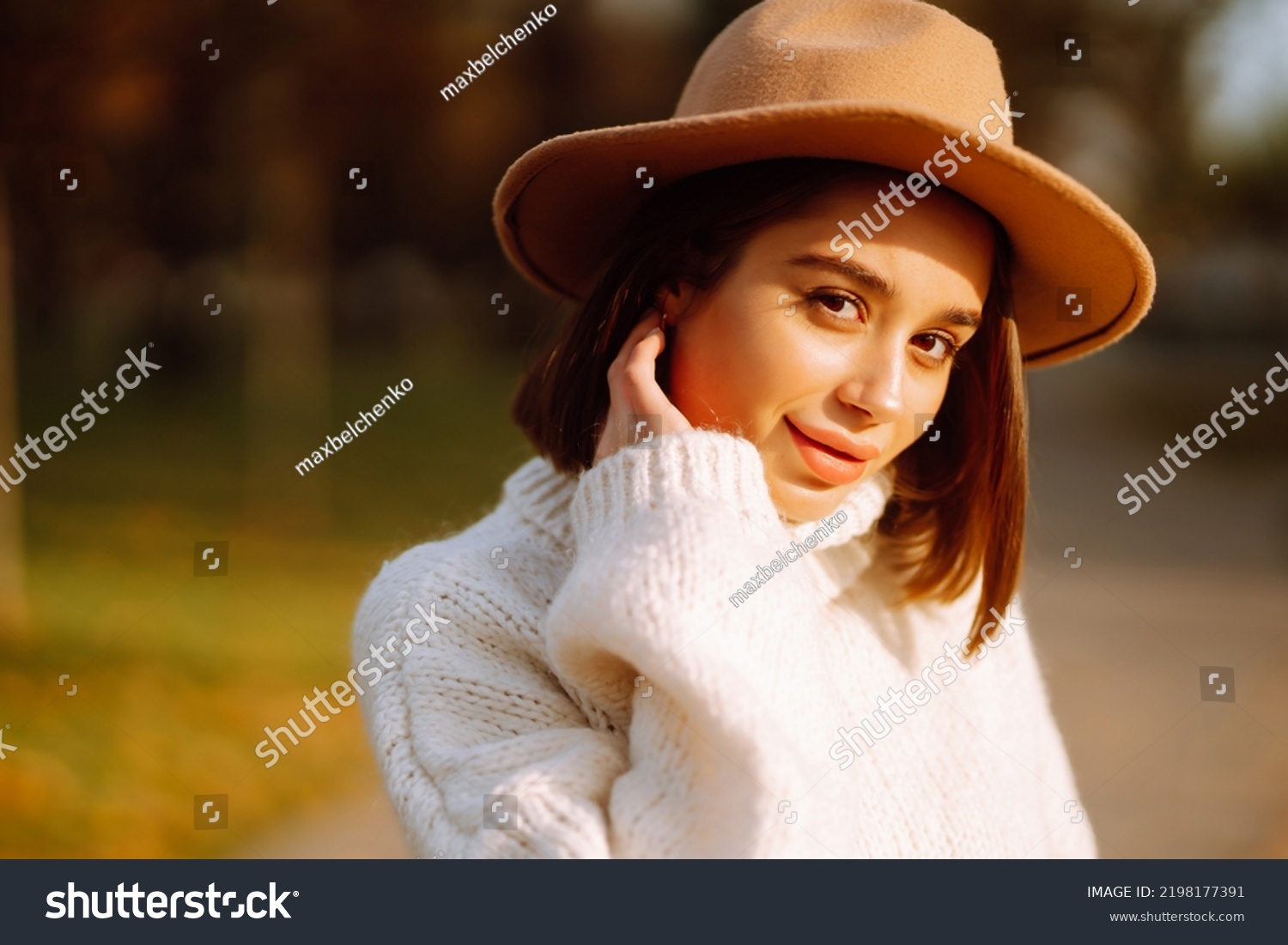 Stylish woman enjoying autumn weather outdoor. Fashion, style concept. People, lifestyle, relaxation and vacations concept. #2198177391
