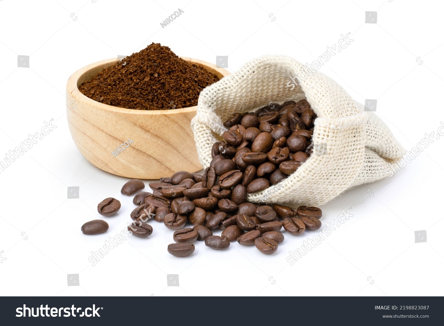 Roasted coffee beans in sack bag with coffe powder (ground coffee) in wooden bowl isolated on white background.  #2198823087