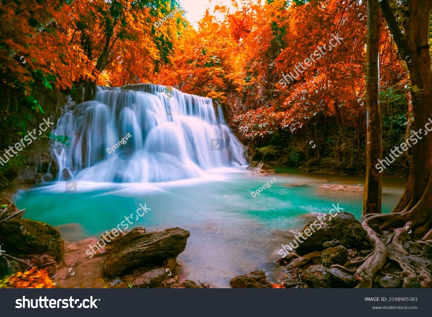 Huai Mae Khamin waterfall at Kanchanaburi Thailand, Hot Springs Onsen Natural Bath is Surrounded by red-yellow leaves. In fall leaves, Waterfall among many foliages, In fall leaves Leaf color change, #2198905383