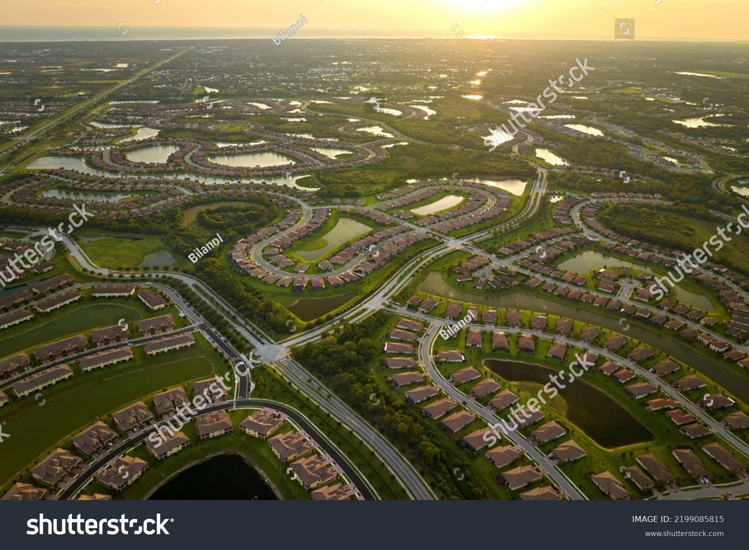 View from above of densely built residential houses in closed living clubs in south Florida. American dream homes as example of real estate development in US suburbs #2199085815