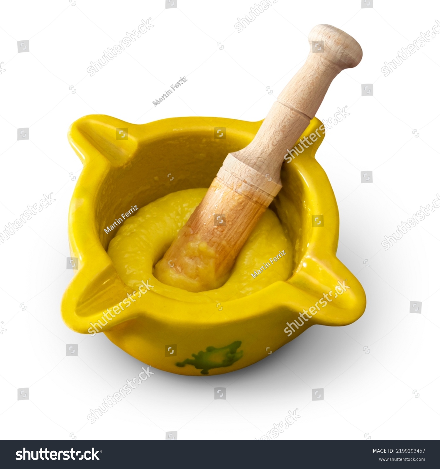 Mortar and pestle with freshly made "alioli" sauce isolated on an empty background #2199293457
