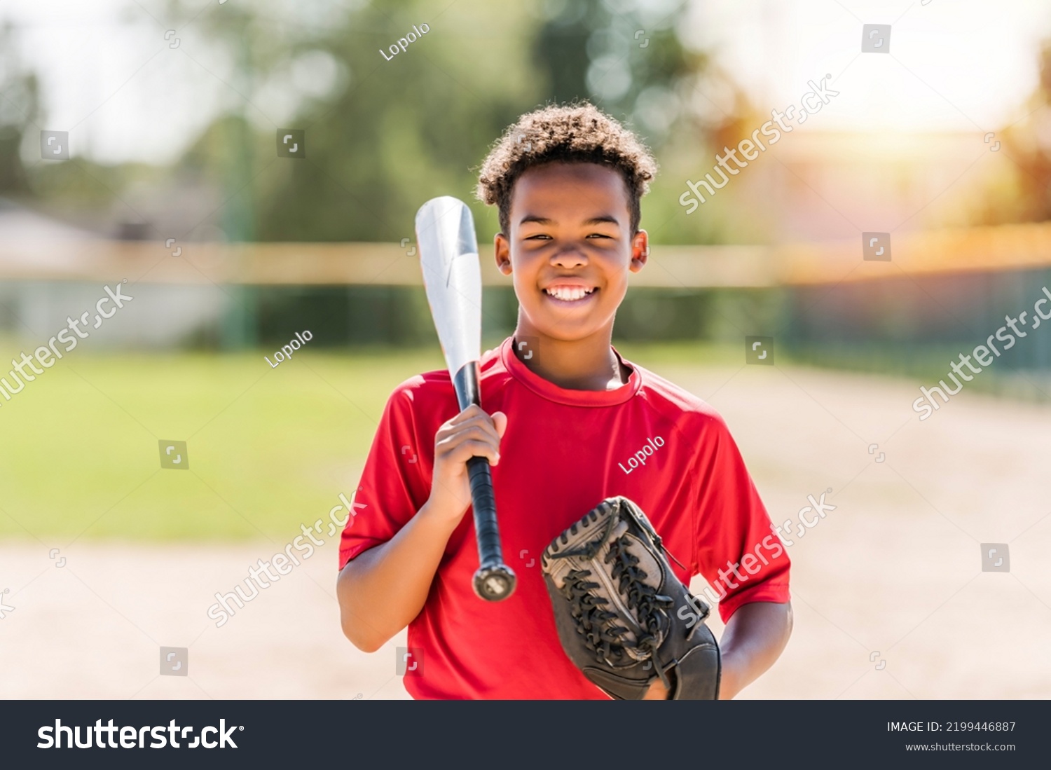 A portrait of child with glove and looking at camera playing baseball #2199446887