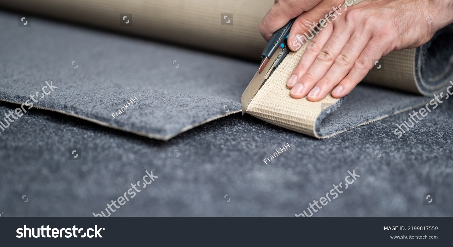 Handyman cutting a new carpet with a carpet cutter. #2199817559