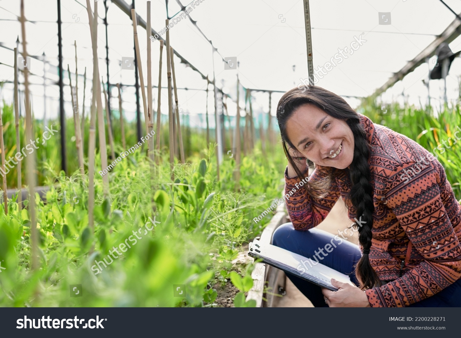 Female  native american research assistant on the field in a greenhouse #2200228271