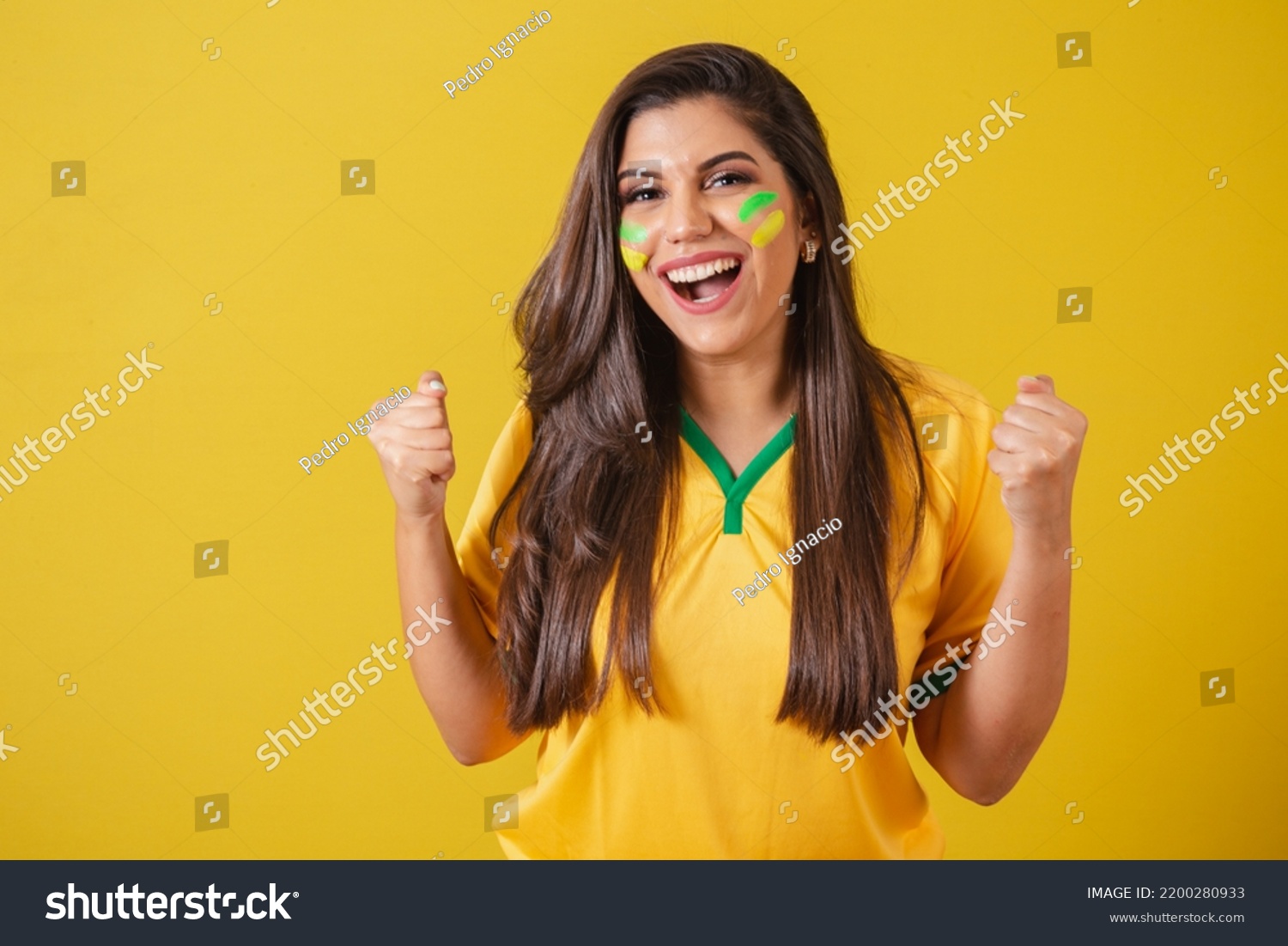 Woman supporter of Brazil, football championship, screaming goal, celebrating team victory and goal. #2200280933