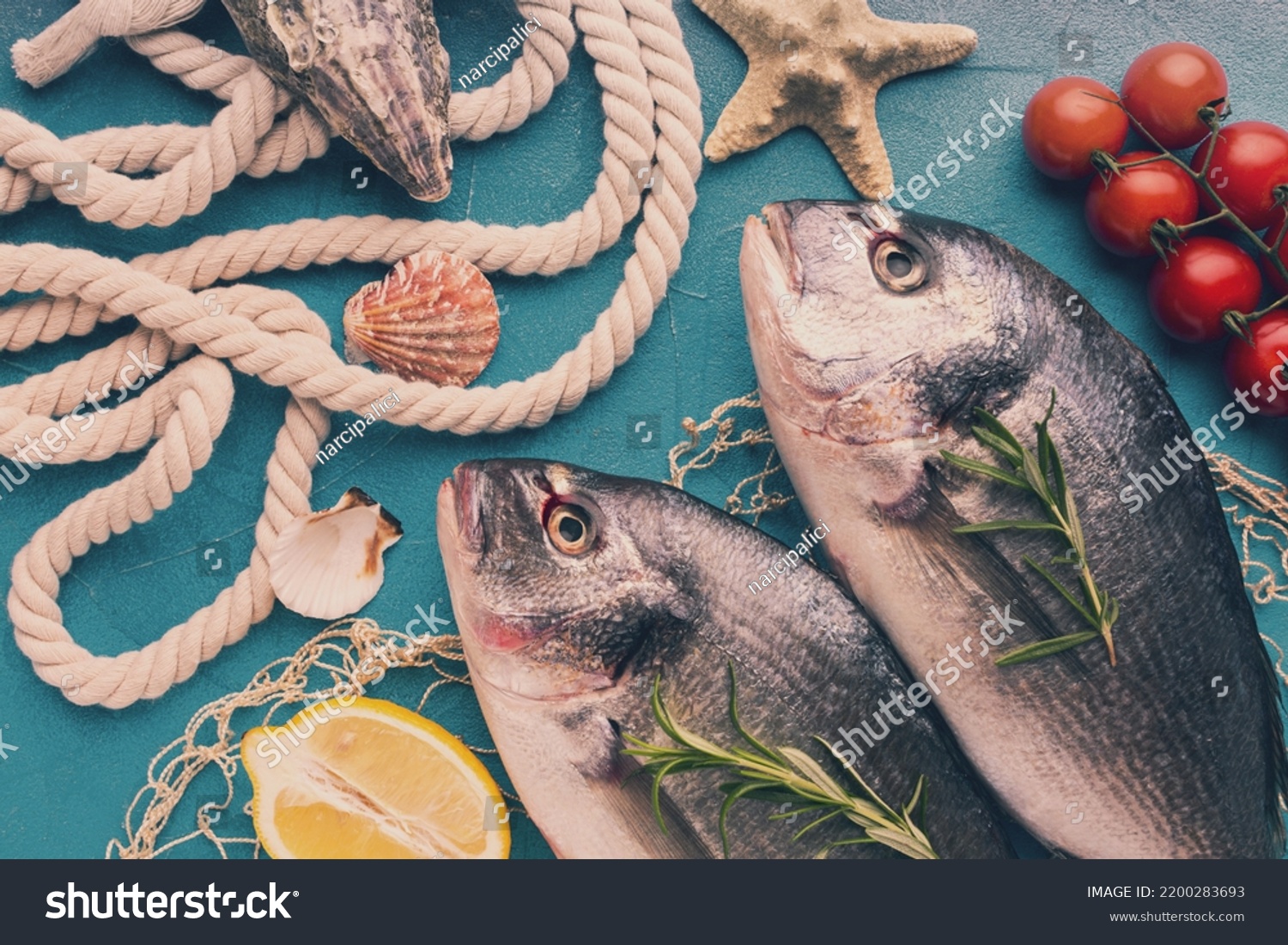 Fish arrangement with lemon top view #2200283693