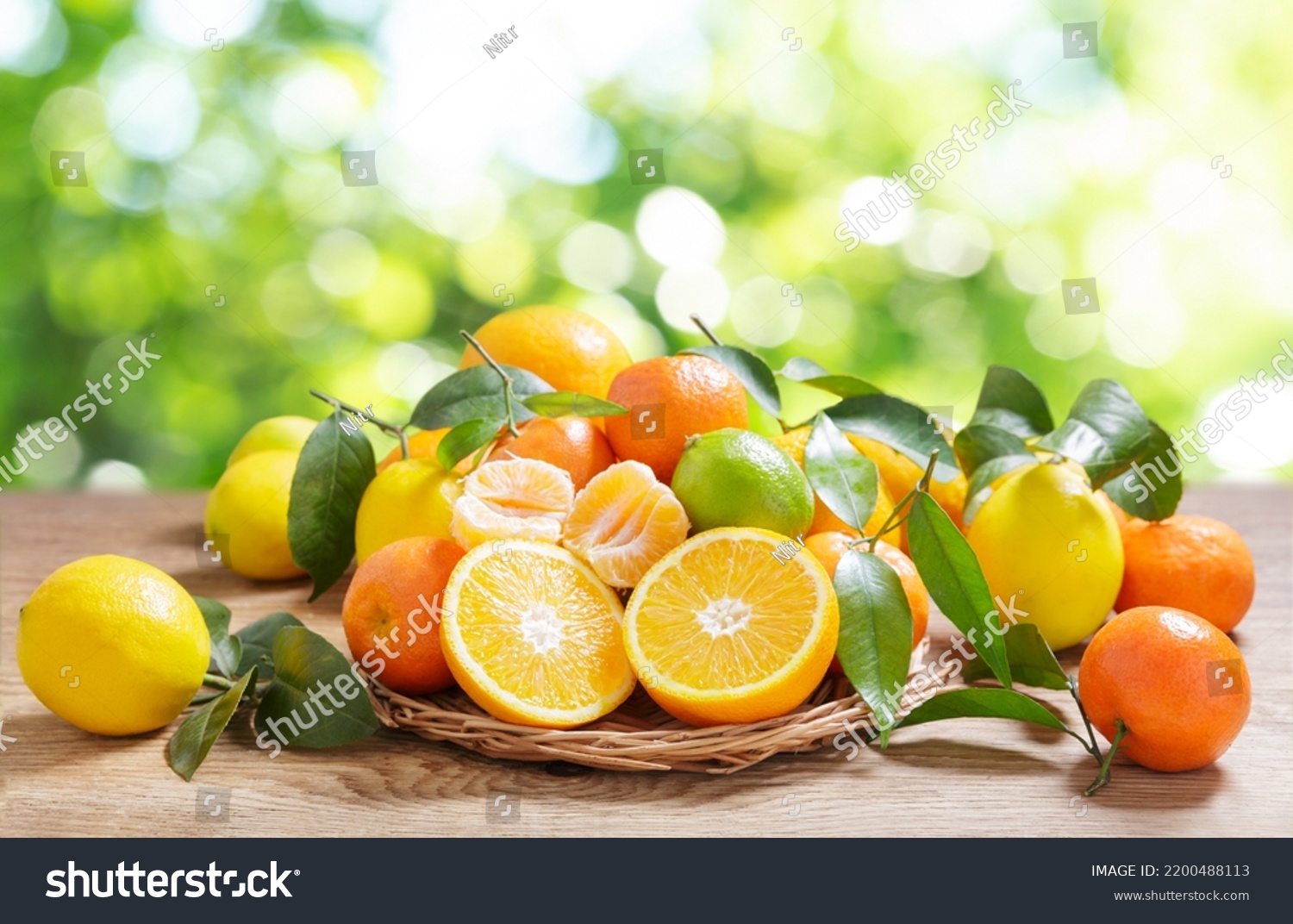 fresh citrus fruits with leaves on a wooden table #2200488113
