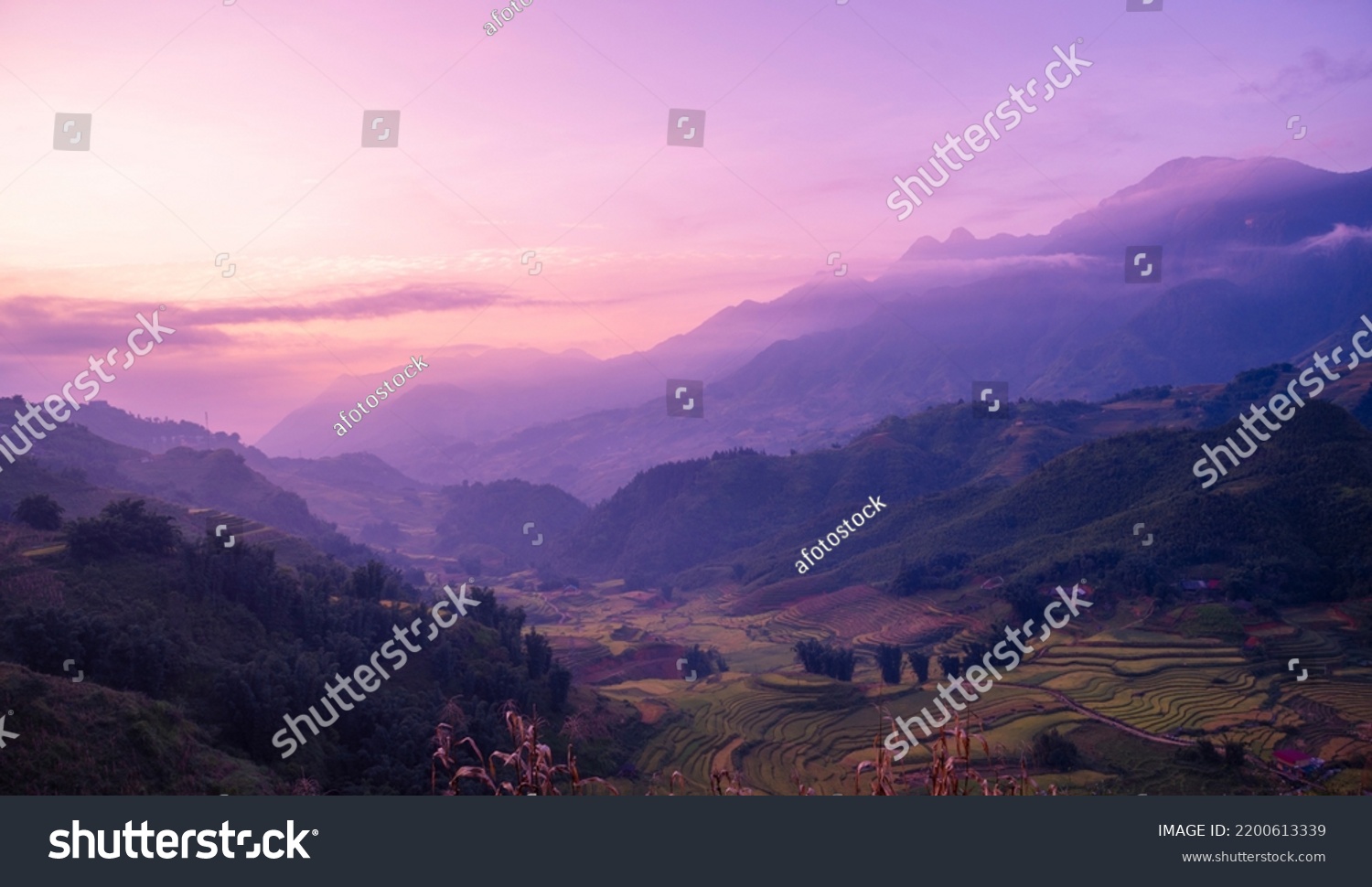 Romantic landscape sunset foggy mountain in evening twilight. Beautiful landscape foggy hills twilight time. Beautiful Purple sky sunrise dramatic landscape mountain. Dawn sky dusk time cloudscape #2200613339