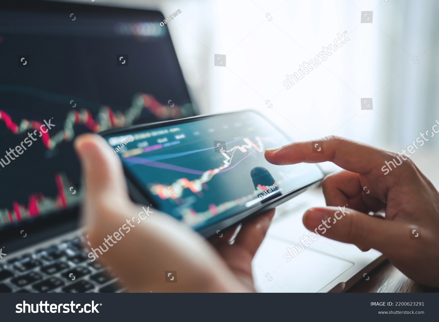 Closeup - Woman is checking Bitcoin price chart on digital exchange on smartphone, cryptocurrency future price action prediction. #2200623291