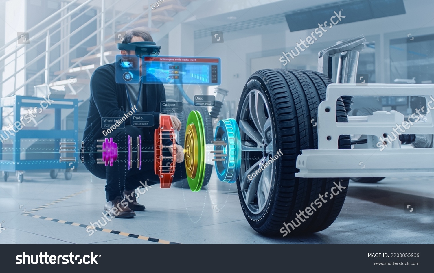 Automotive Engineer Working on Electric Car Chassis Platform, Using Augmented Reality Headset with 3D VFX Software for Development of Regenerative Braking System on a Transport Vehicle. #2200855939