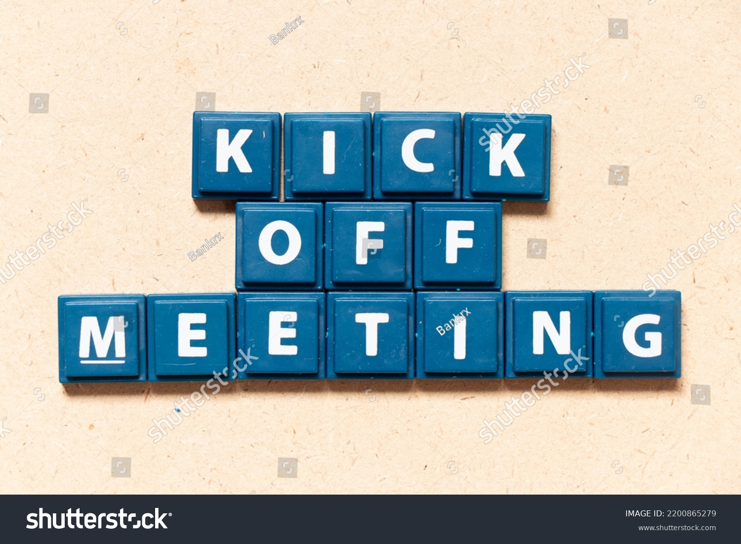 Tile letter in english word kick off meeting on wood background #2200865279