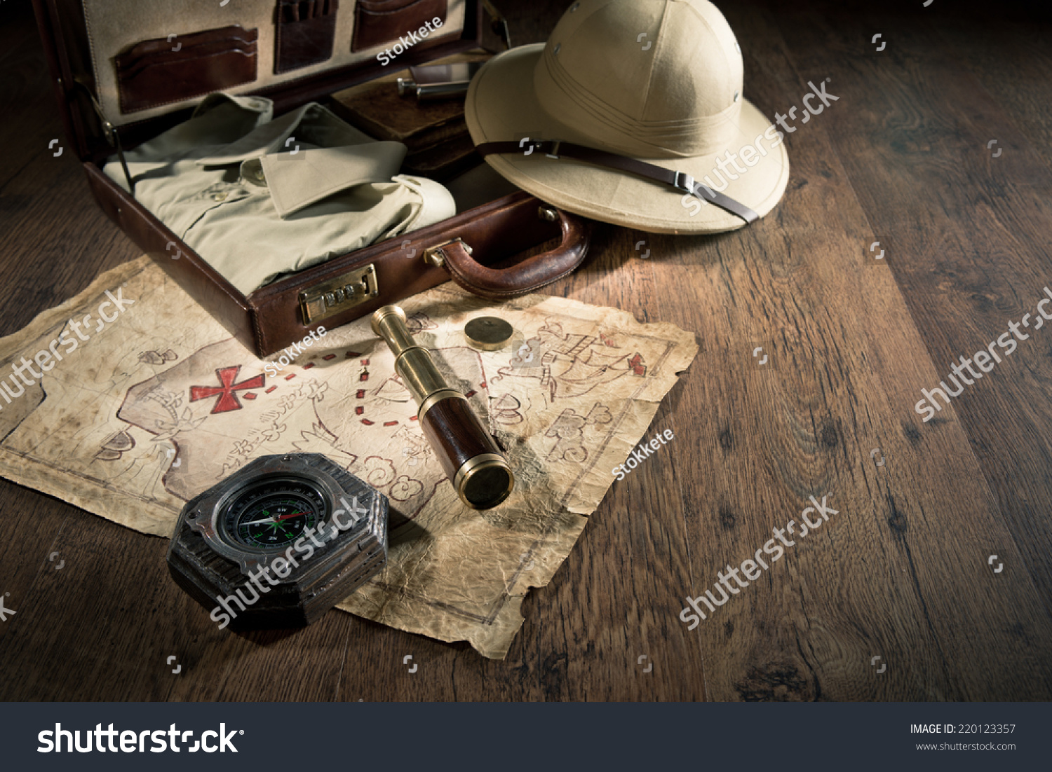 Old treasure map with colonial style pith hat, bras telescope and compass. #220123357