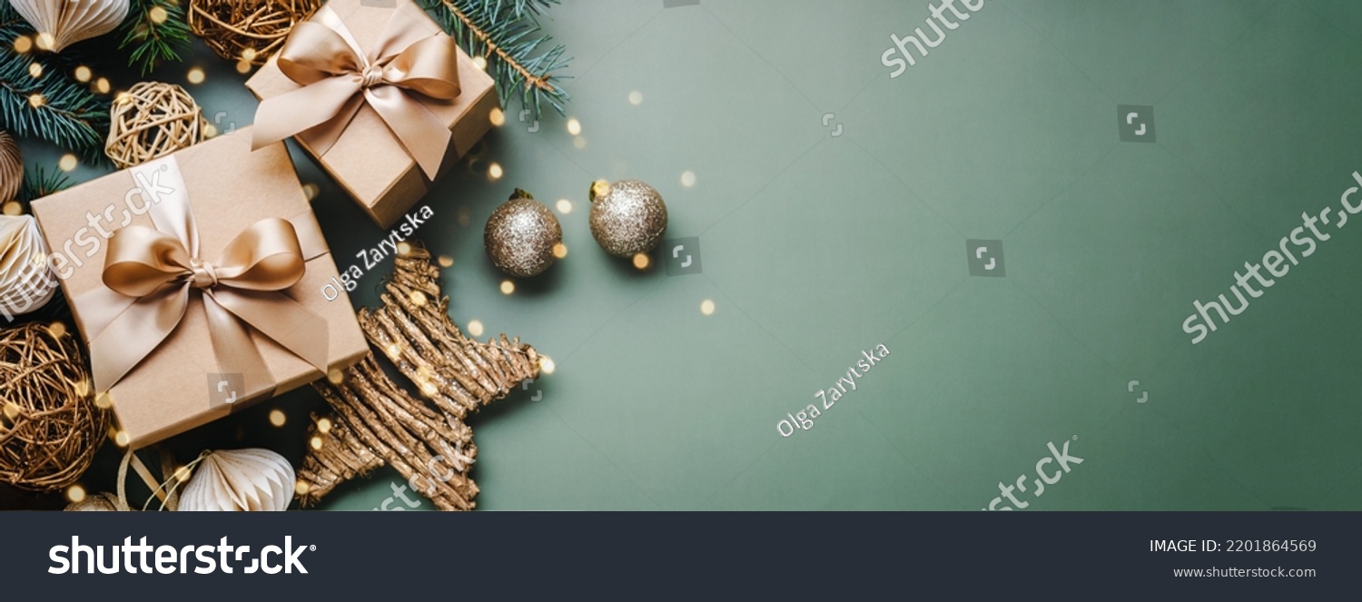 New Year banner with Christmas gift boxes and golden decorations on khaki background. #2201864569