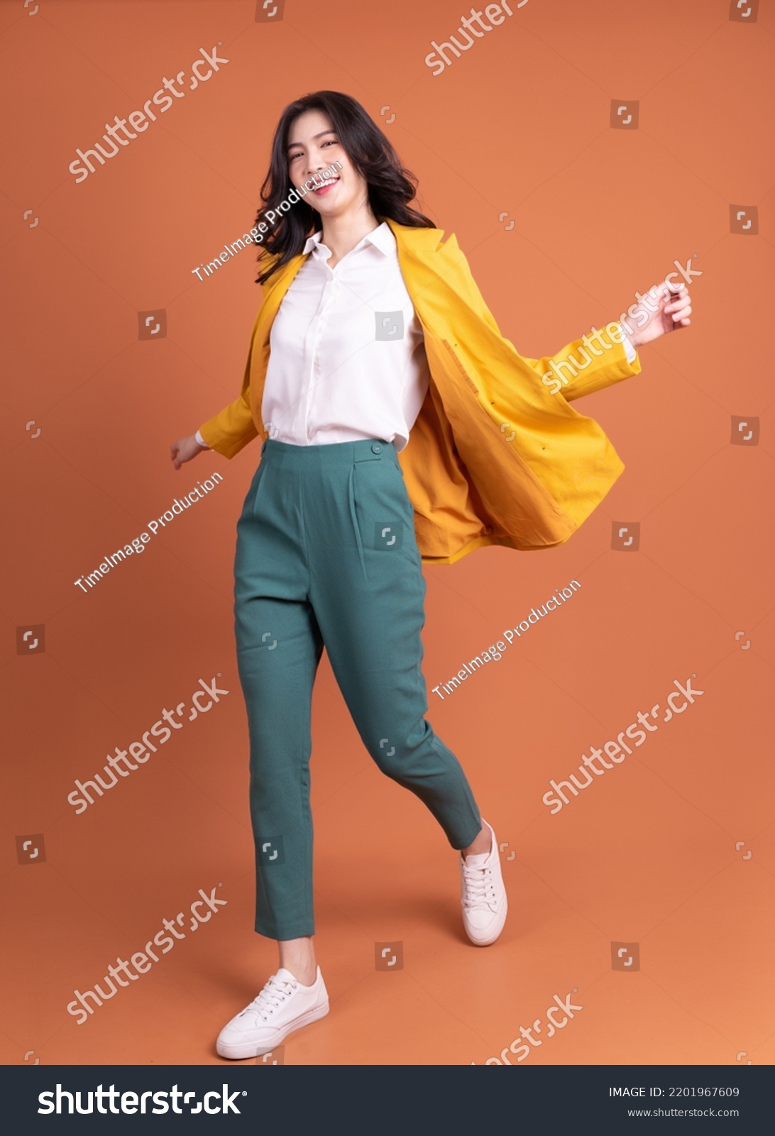 Full length photo of young Asian woman on background #2201967609