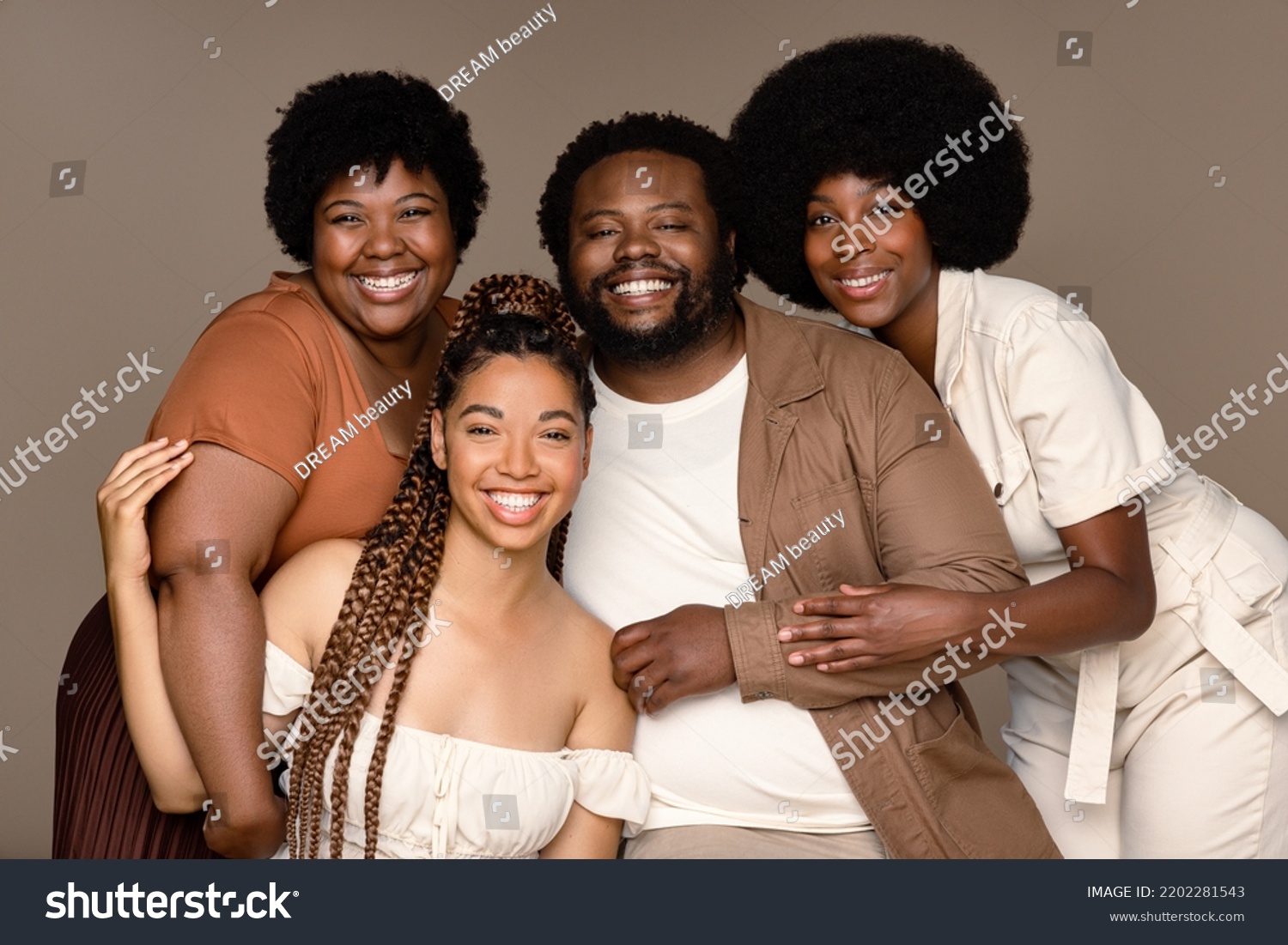 Portrait of a group of gorgeous multiracial people smiling together on a neutral background. #2202281543