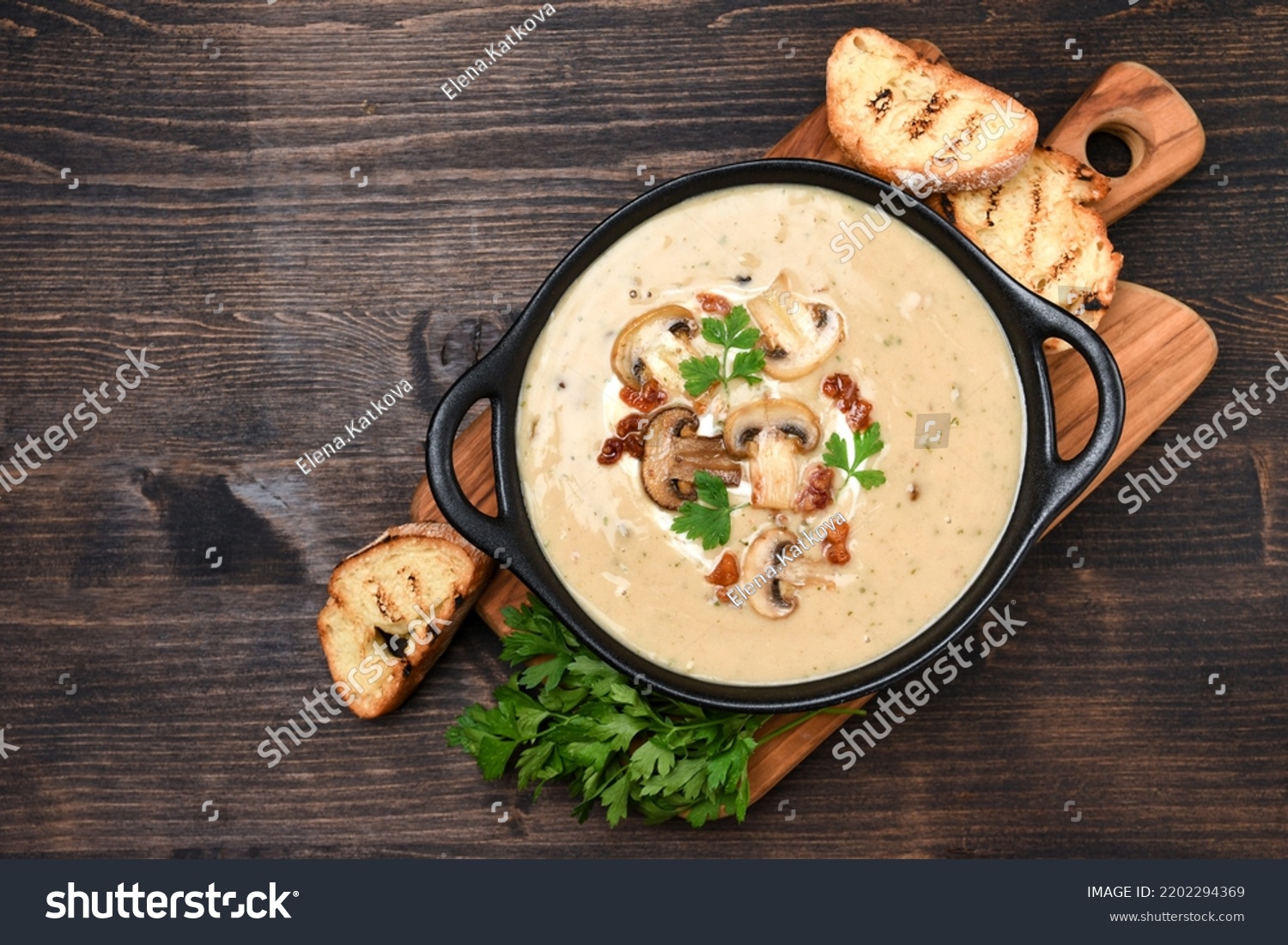 Mushroom champignon soup with bread and fresh mushrooms. top view , autumn seasonal cream soup with vegetables  #2202294369