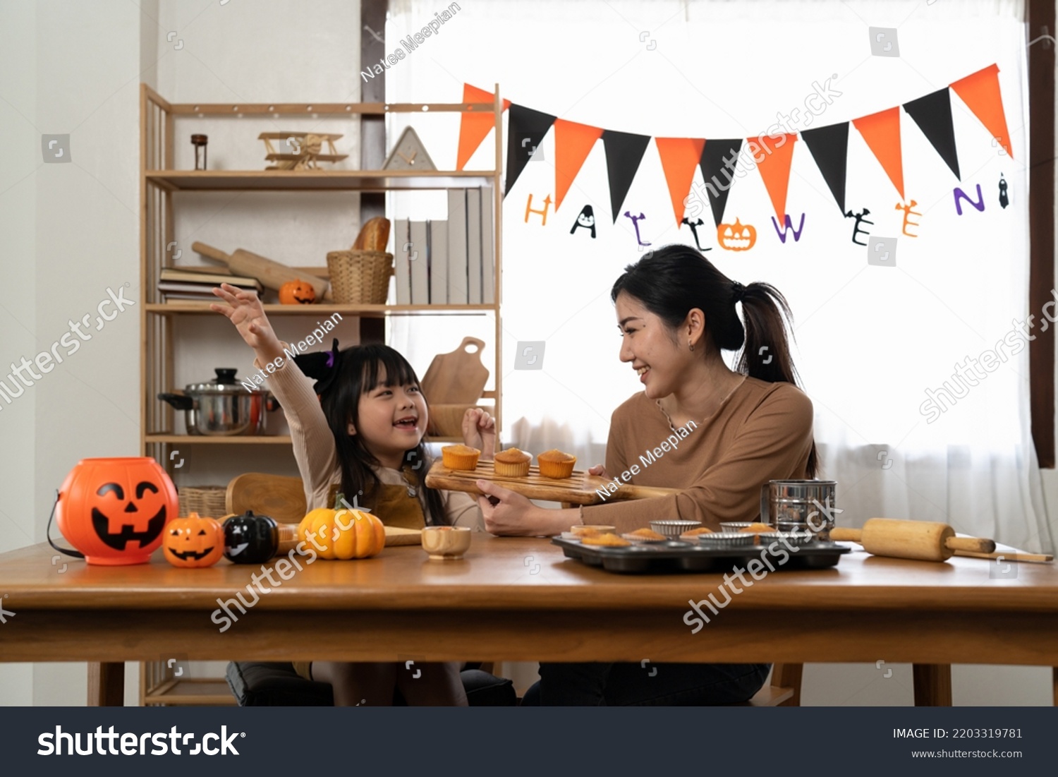 Happy family mother and child happy girl with holiday Halloween. Happy Halloween. Recipe pumpkin puree. Ingredients for pumpkin pie for Thanksgiving day #2203319781