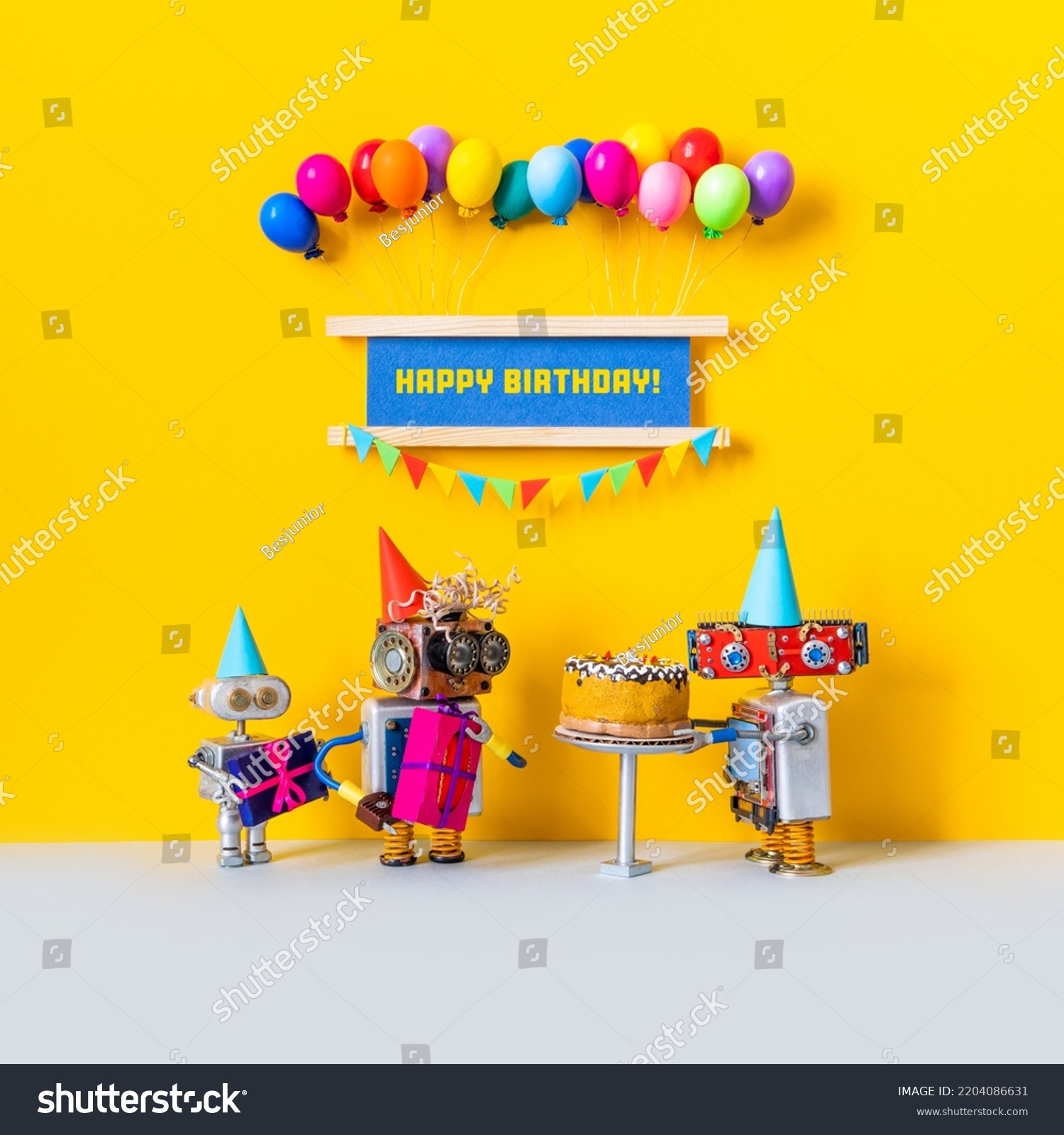 Funny holiday poster. Happy birthday congratulation greeting card. Toy robot holding a birthday cake, festive banner decorated with balloons, garland of flags #2204086631