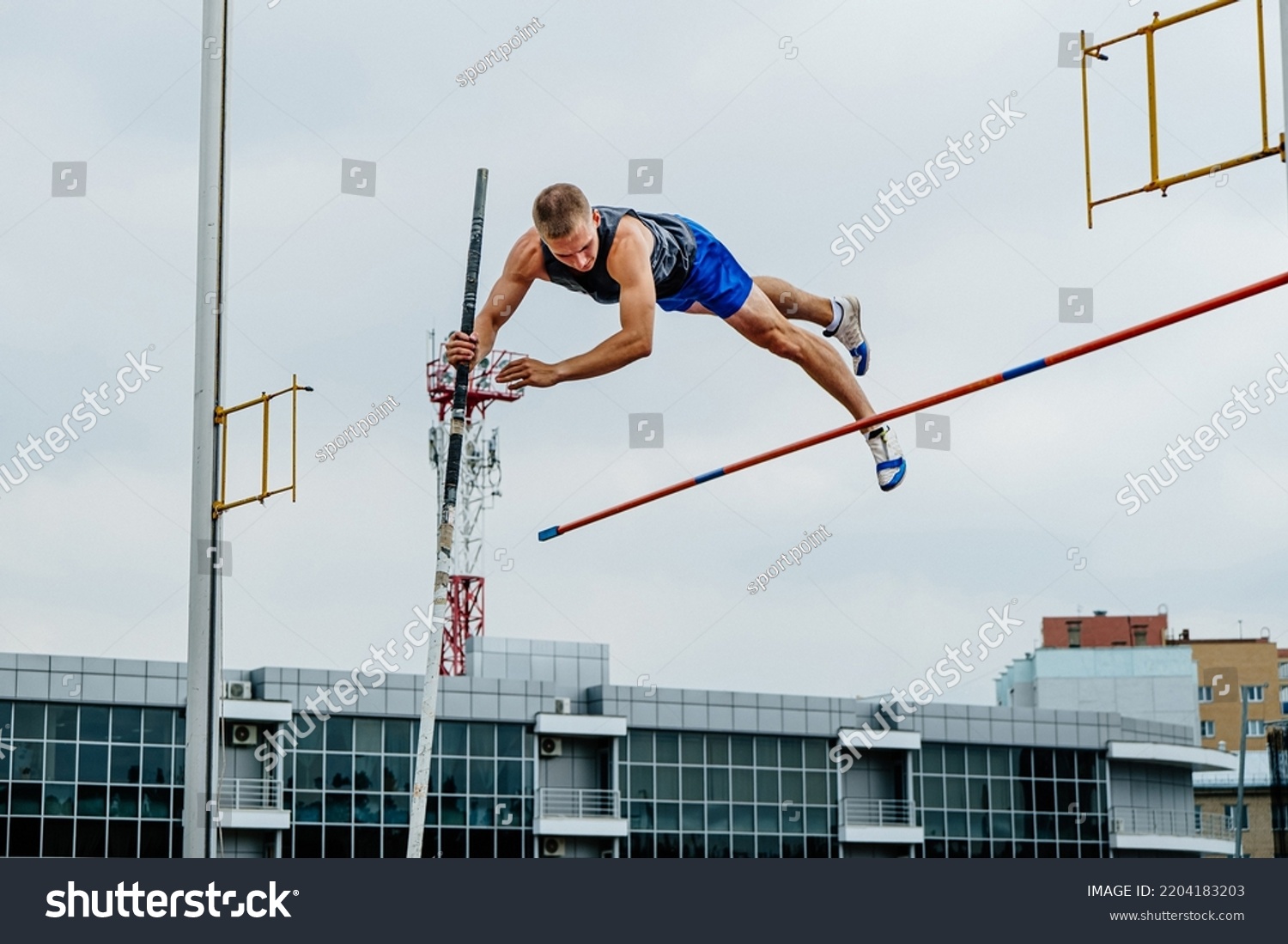 male athlete unsuccessful attempt pole vault #2204183203