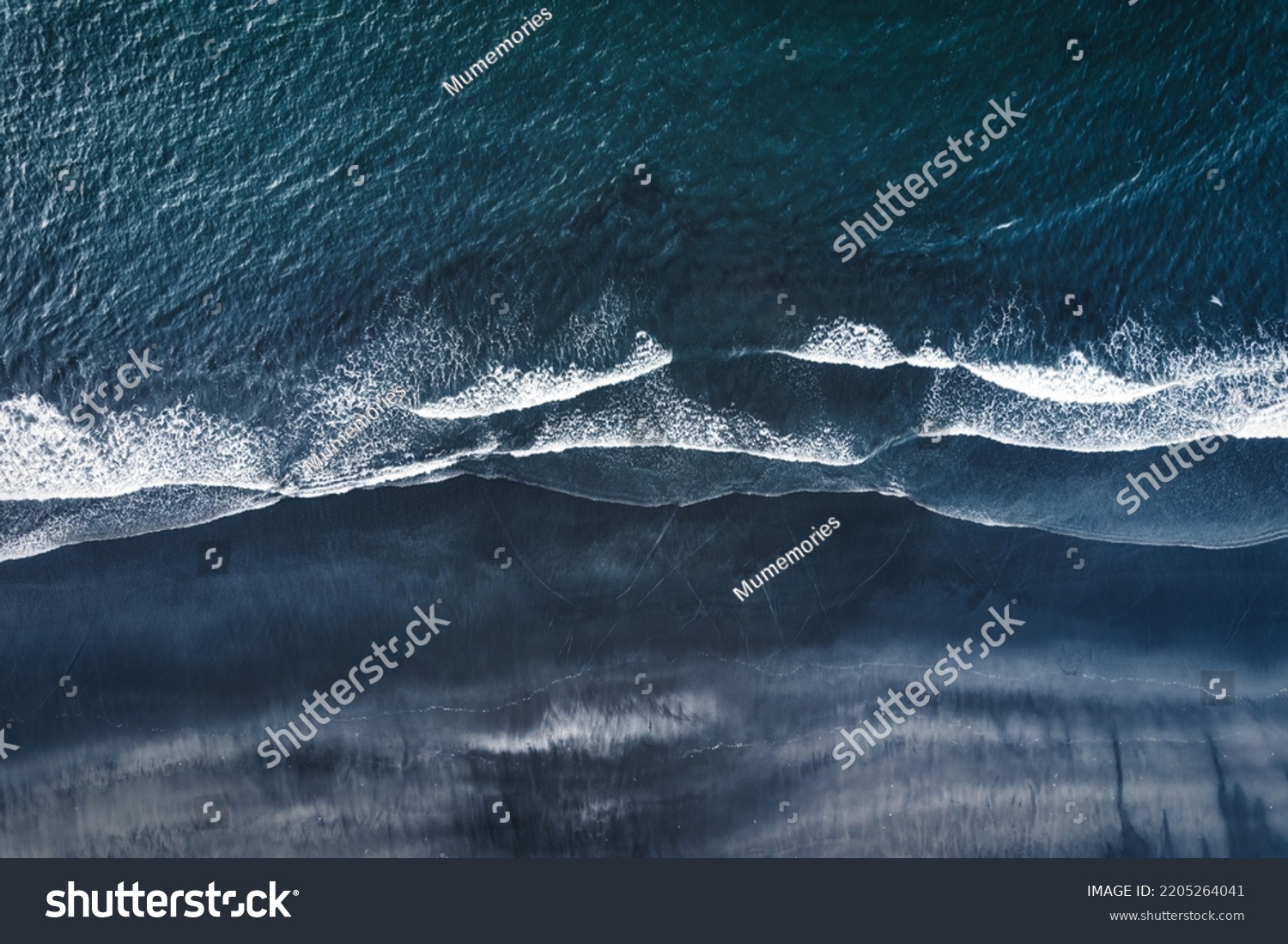Aerial drone view of moody atlantic ocean wave on black sand beach in summer at Iceland #2205264041