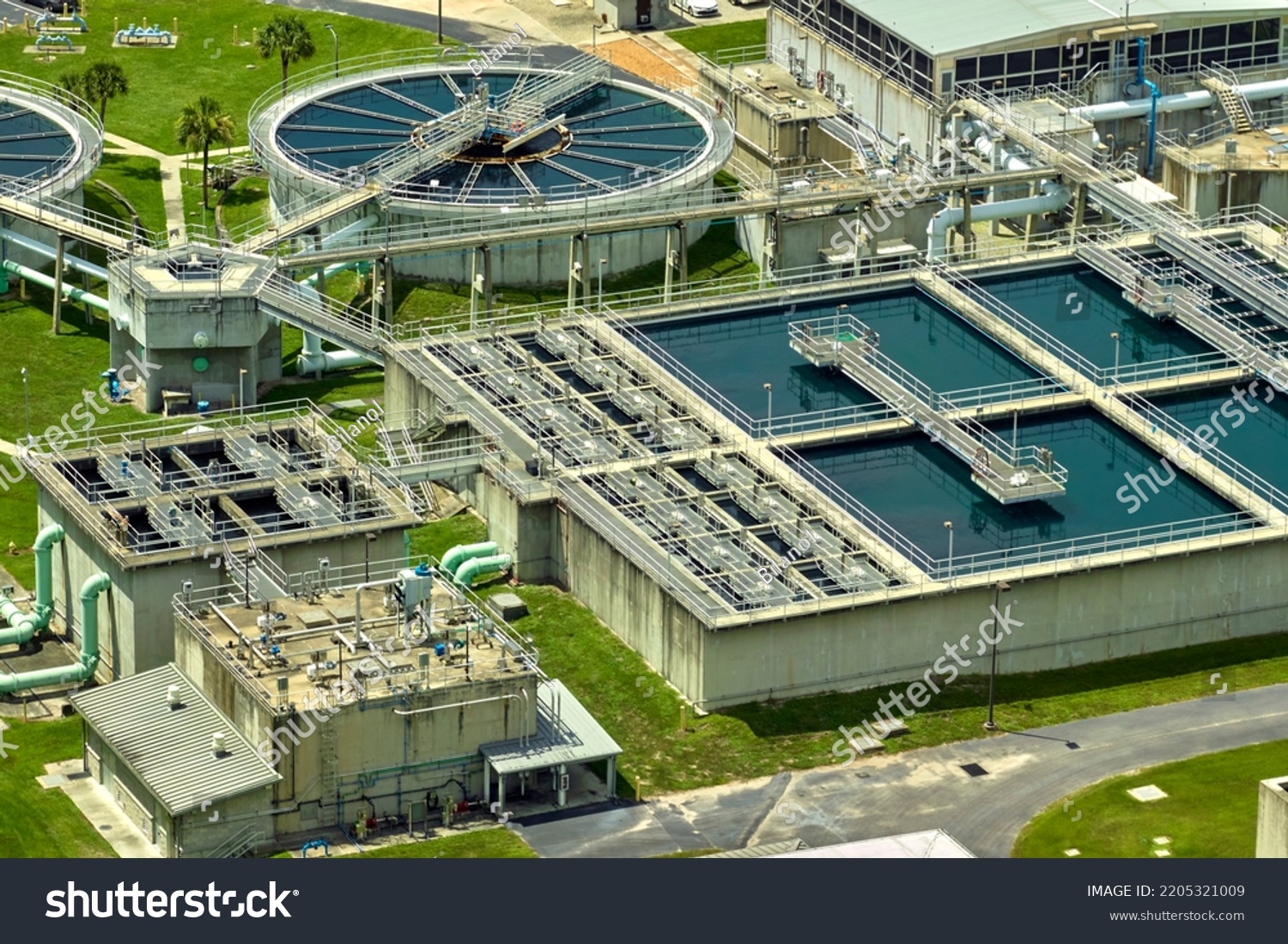 Aerial view of modern water cleaning facility at urban wastewater treatment plant. Purification process of removing undesirable chemicals, suspended solids and gases from contaminated liquid #2205321009