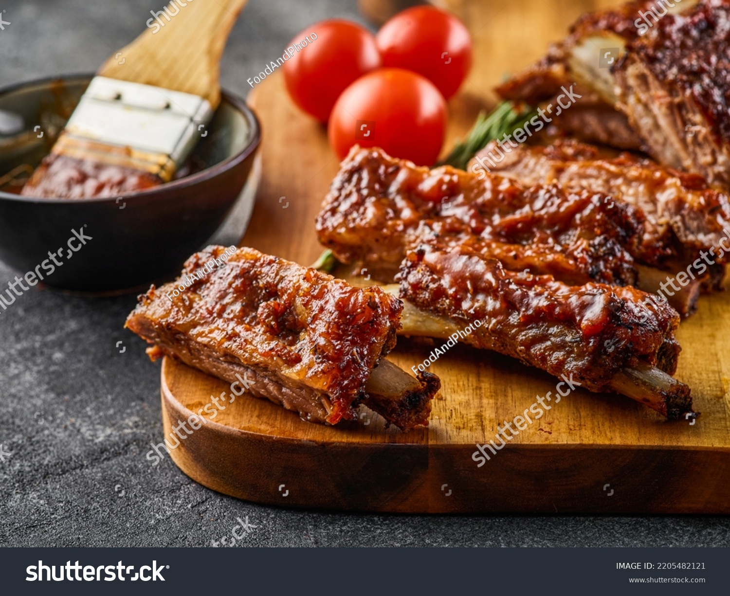 Barbecued and marinated sticky spare ribs. Grilled spare ribs. American style pork ribs. #2205482121