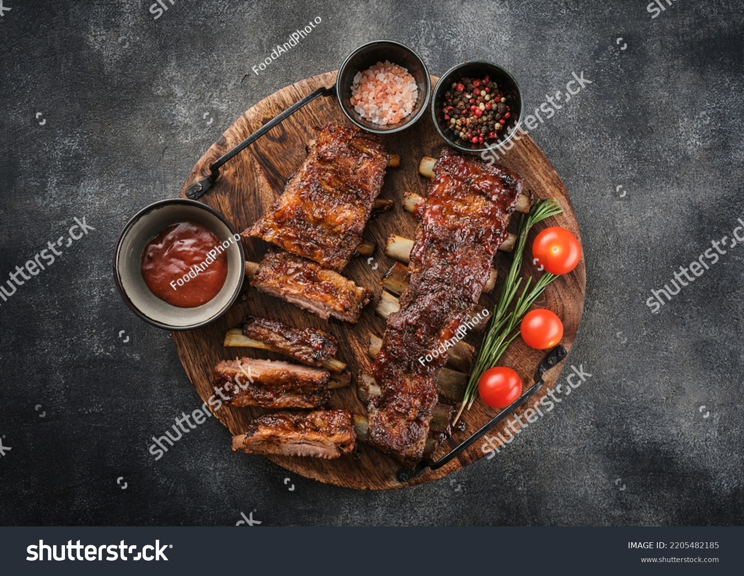 Delicious barbecued ribs seasoned with a spicy basting sauce. Smoked American style pork ribs. #2205482185