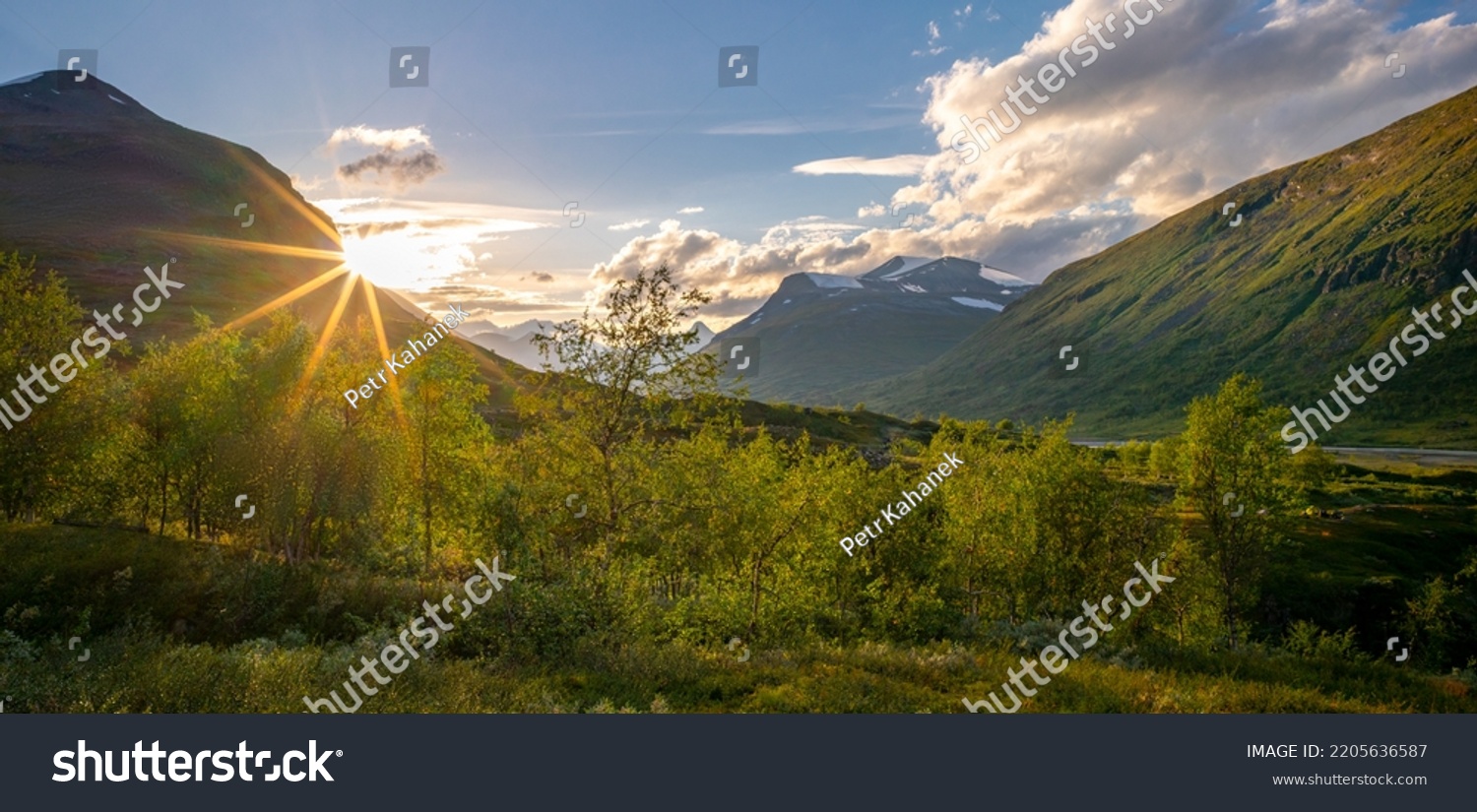Sun setting behind the mountain in remote Arctic valley. Sarek National Park, Lapland, Sweden. Sun star. Hiking in remote wilderness of Laponia. Sunset in the mountains. #2205636587
